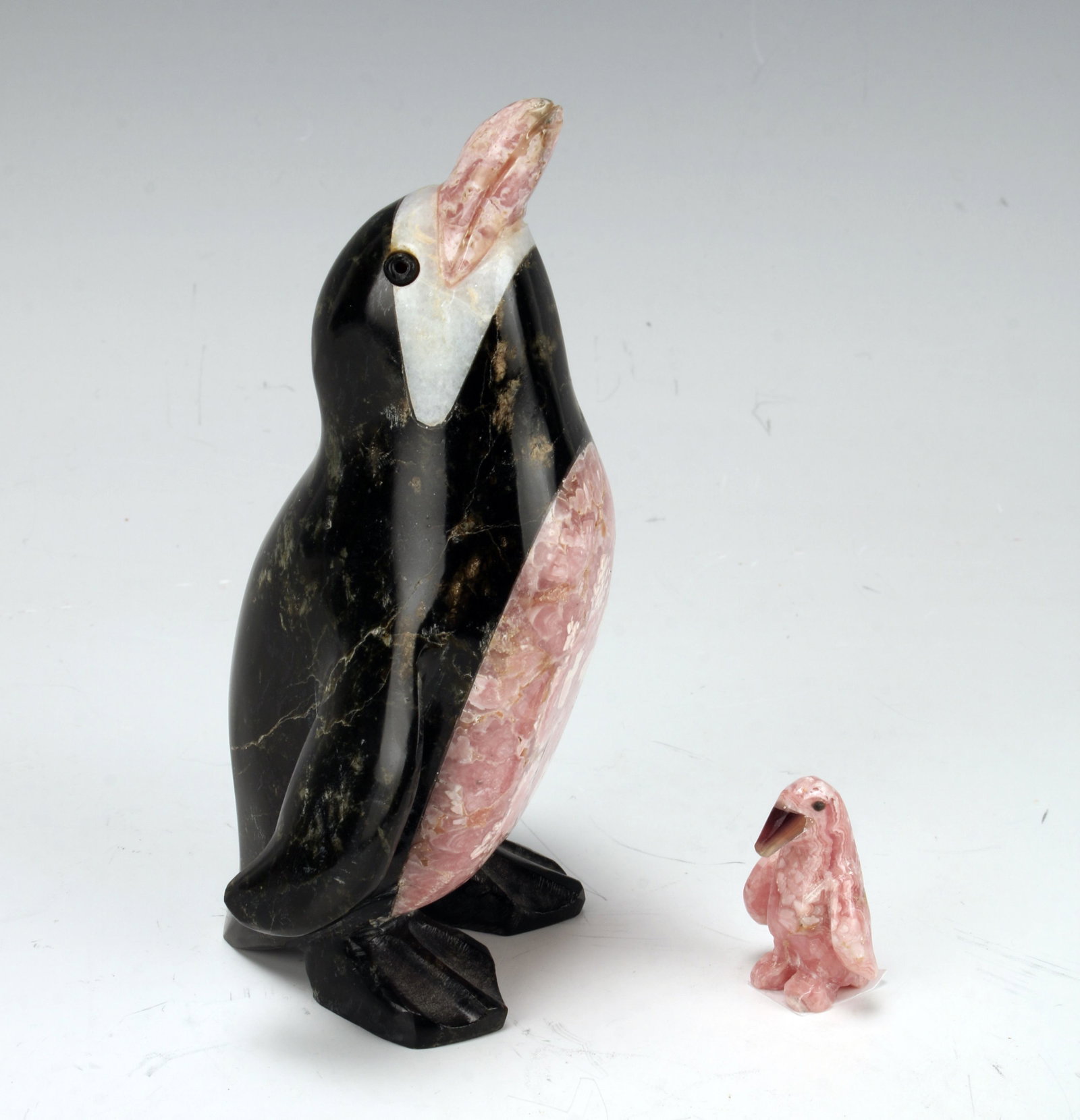 MOTHER & BABY STONE PENGUINS: The mother penguin is in black, pink and white stone and the baby is all in pink with a black beak and eyes. 3" X 5" $40 - $80 Please contact us for high resolution images of this lot.