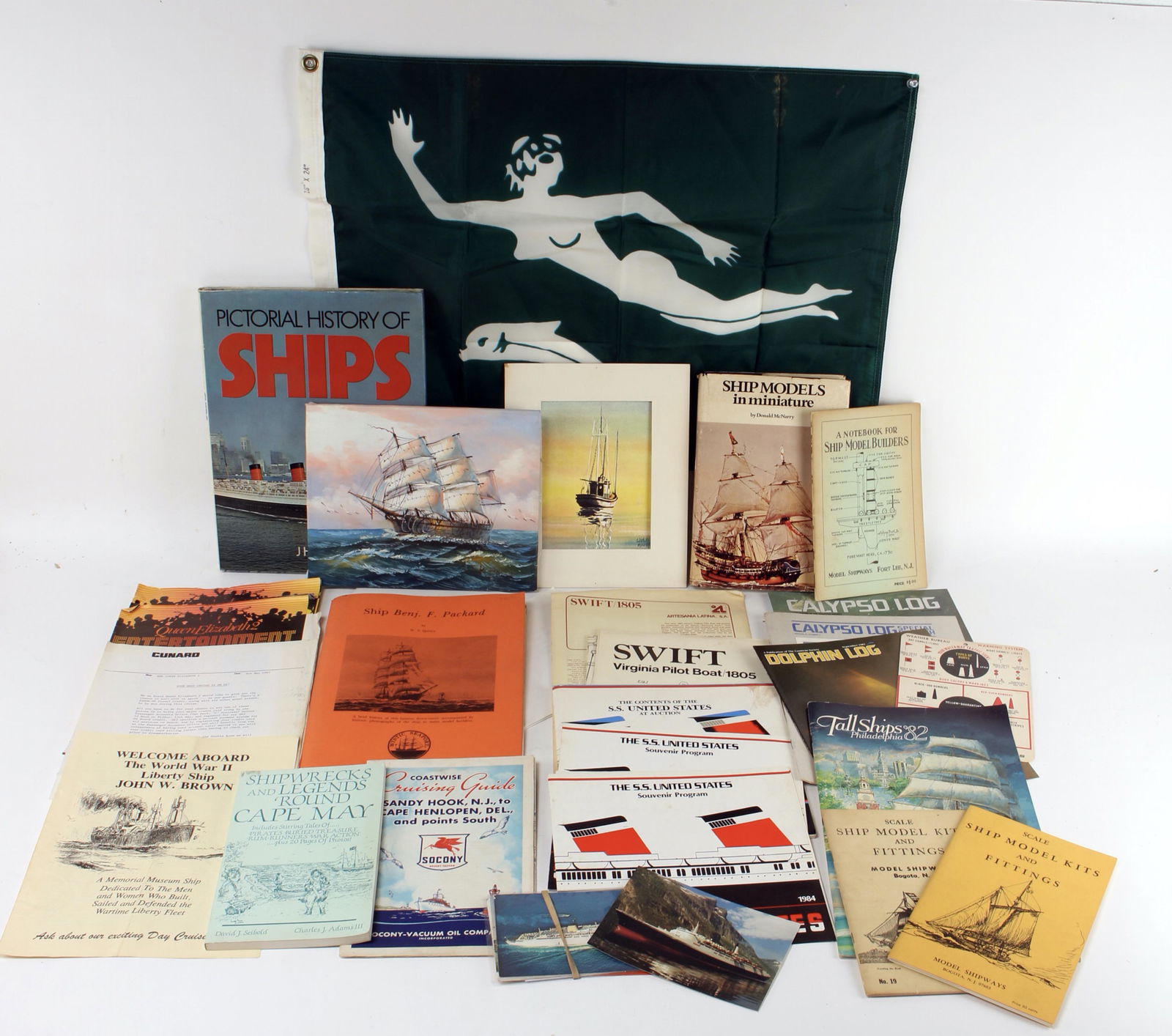 LARGE LOT OF SHIP BOOKS, PLANS, AND MEMORABILIA: Rigging plans, belaying plans, lines and deck plan, and brochure for the Packard. Plans for Swift Virginia Pilot Boat booklet. Book on Cape May ship wrecks, and books on ship models. Auction catalog o