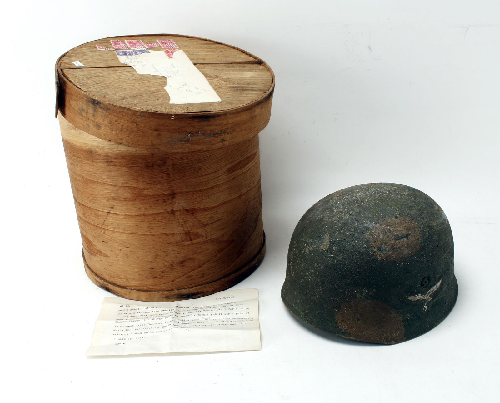 GERMAN ARMY LUFTWAFFE HELMET: In shipping crate with canceled stamps and letter dated Oct. 3 1950 speaking of how the helmet came into his possession and who it was for. Provenance: Bought in Italy a few years after the war. Other