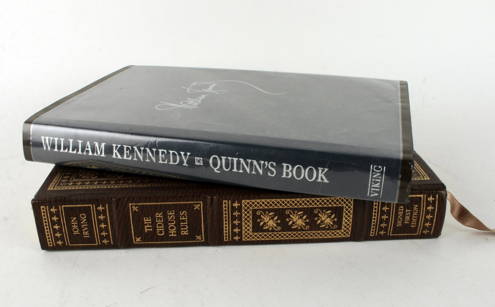 1ST ED SIGNED QUINNS BOOK & CIDER HOUSE RULES: Quinn's Book by William Kennedy, *signed, first edition, copy 46/500, hardcover copyright 1988. The Cider House Rules by John Irving, *signed, first edition, hardcover, gilt edge. *Converse Auctions d