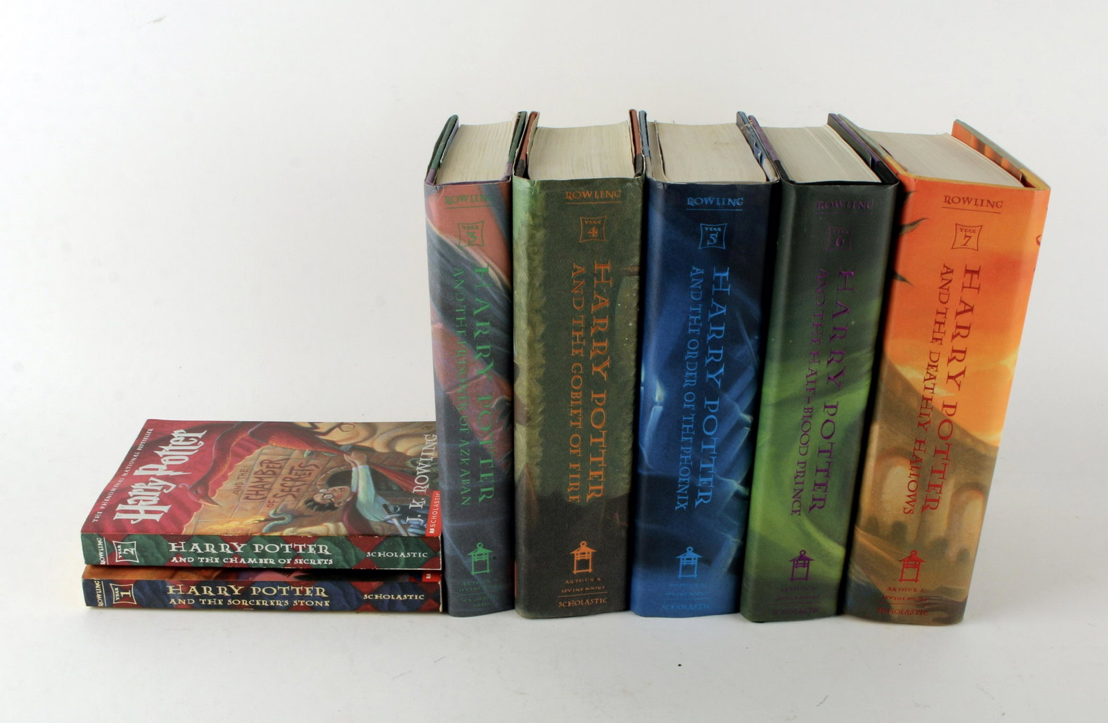 LOT OF HARRY POTTER BOOKS HCDJ: Five hard cover with dust jacket: The Deathly Hallows, The Order of the Phoenix, The Half-Blood Prince, The Goblet of Fire, and The Prisoner of Azkaban. Two paperbacks: The Sorcerer's Stone, and The C
