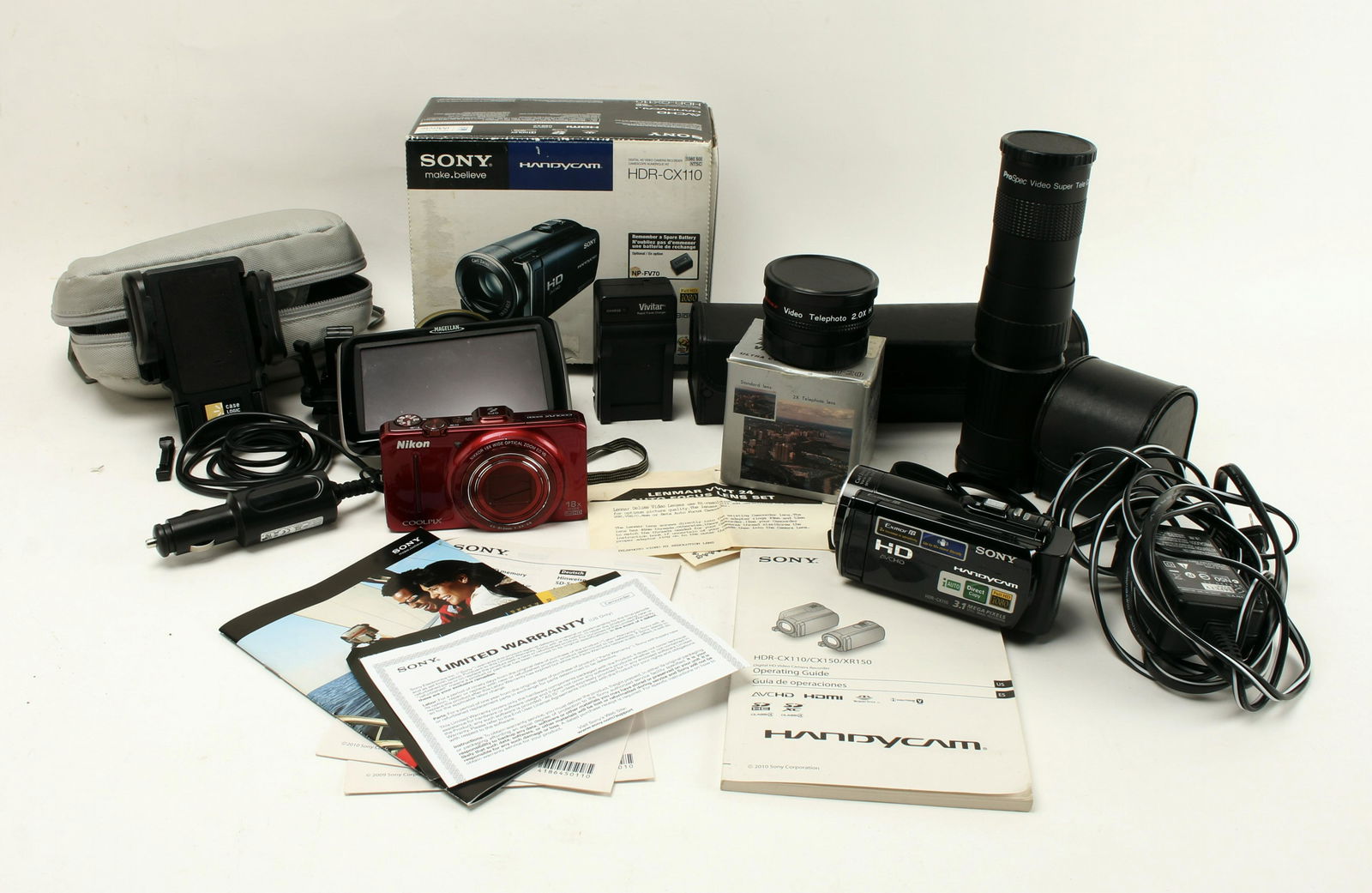 A/V CAMERA MEDIA LOT: Including cell phone car set up with holder and charger. Vivitar rapid travel charger. Nikon Coolpix digital camera (no tested). Lenmar Hi-resolution auto focus video lens. ProSpec video super tele Co