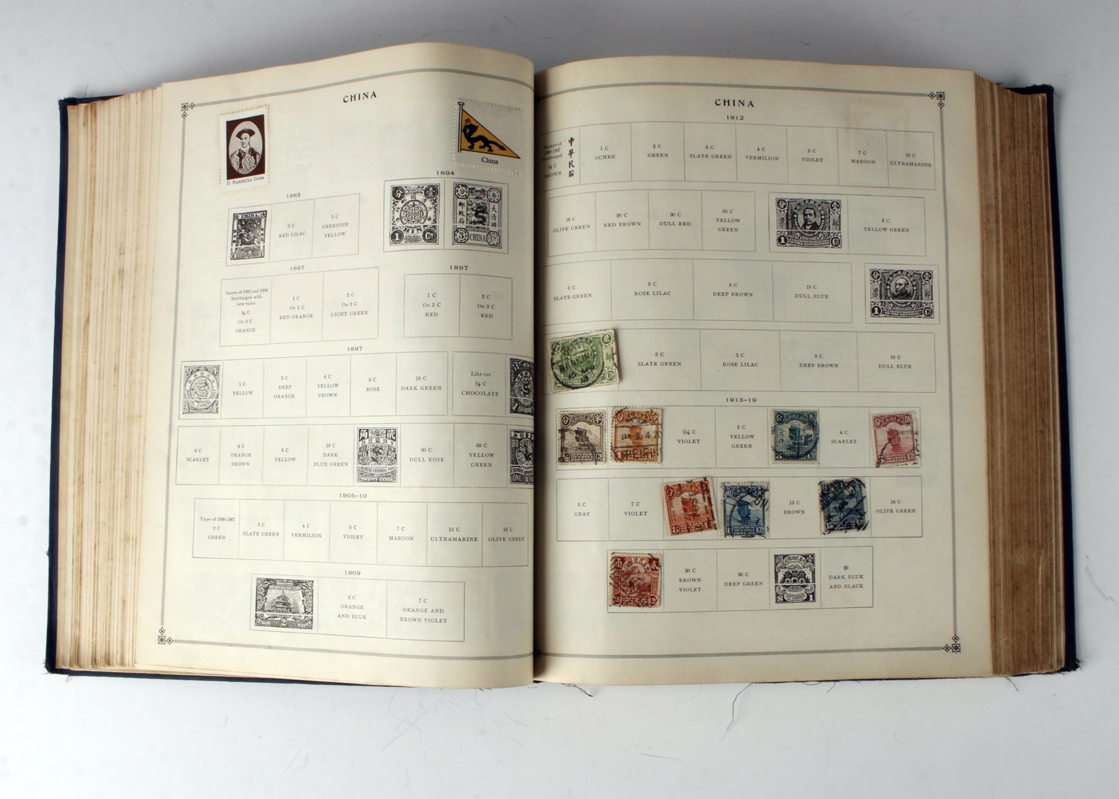 ANTIQUE INTERNATIONAL STAMP ALBUM 1857 - 1930: Earliest American stamps 1857 - 1860. International stamp dates range from 1870s - 1930s. 1924 Russian stamp. Nyssa stamp. Including loose stamps. Album dated 1930. 9 1/2" X 11 1/2" $100 -