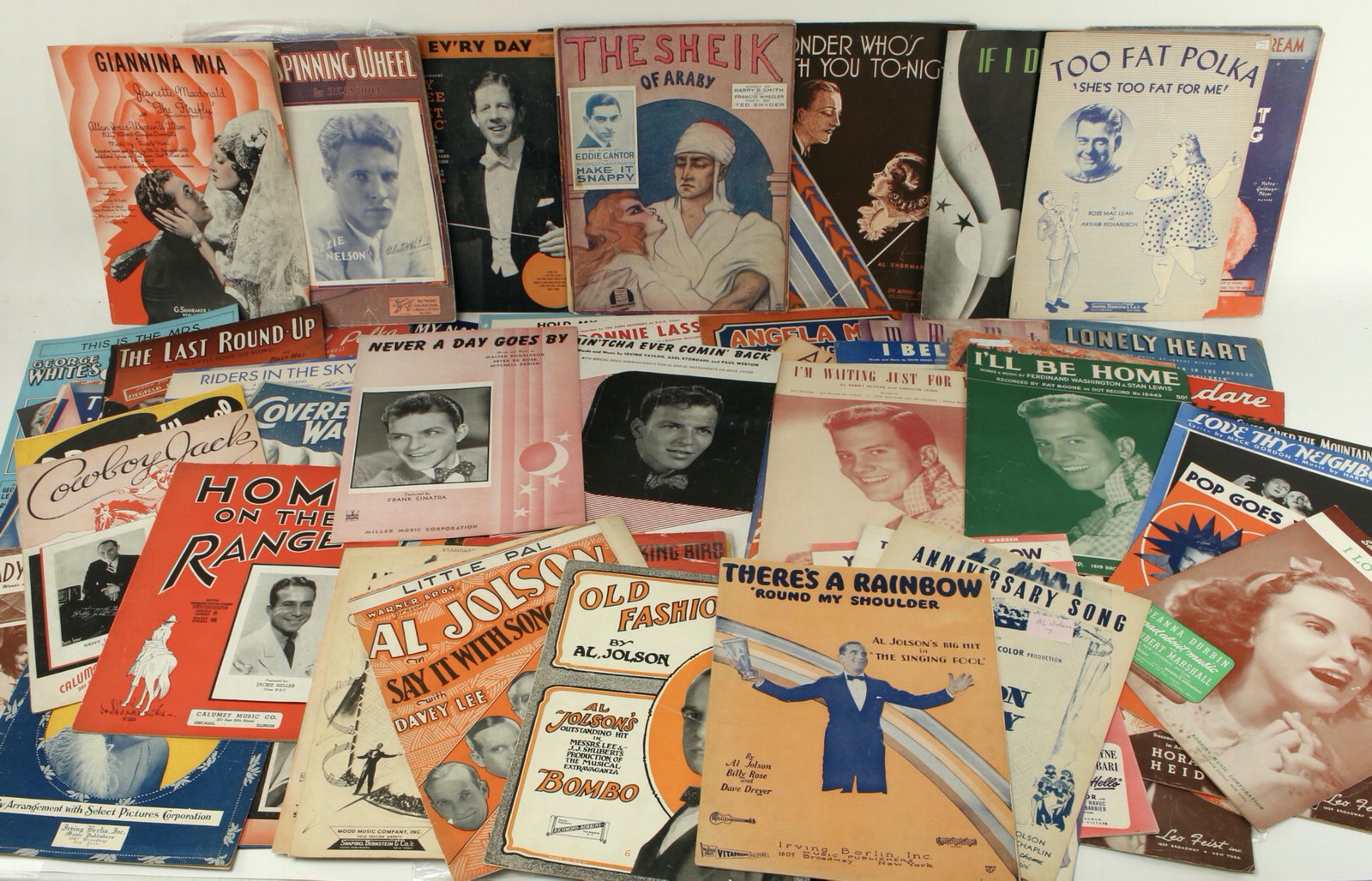 LOT OF SHEET MUSIC 1920S - 1950S: 1920s - 1950s. Polka, Sinatra, Pat Boone, Al Jolson, cowboy tunes, and more. $20 - $40 Please contact us for high resolution images of this lot. Shipping: We are able to pack and ship this