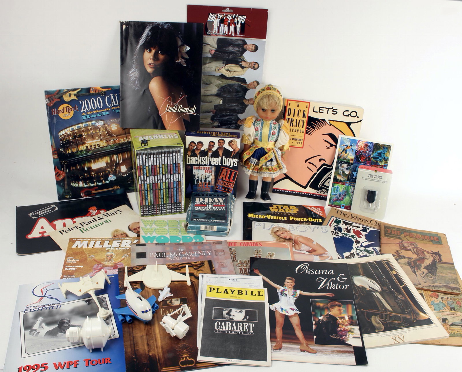 LARGE MUSIC POP CULTURE LOVERS MEMORABILIA LOT: Coverless Archie Comics, Backstreet Boys VHS tapes and tour merchandise, books on tape, Dick Tracey Case Book, Hard Rock Cafe 2000 Calendar. Peter Paul & Mary reunion brochure, Annie program, 1989