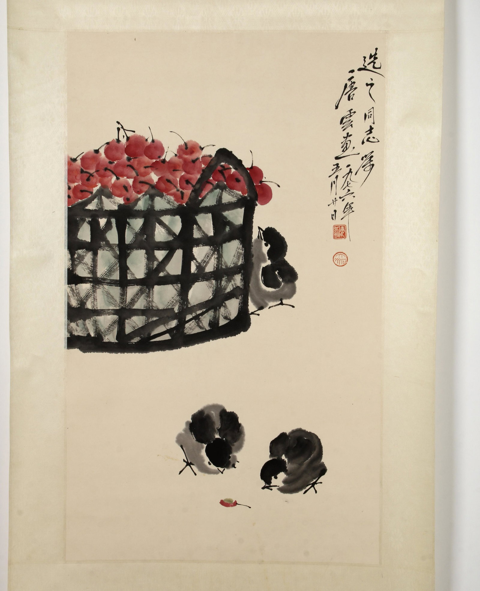 CHINESE SCROLL OF CHICKS AND CHERRIES: Chicks surround a basket of cherries. Calligraphy and artist marks on the upper right. 25 1/2" X 68" $200 - $400 Please contact us for high resolution images of this lot. Shippi