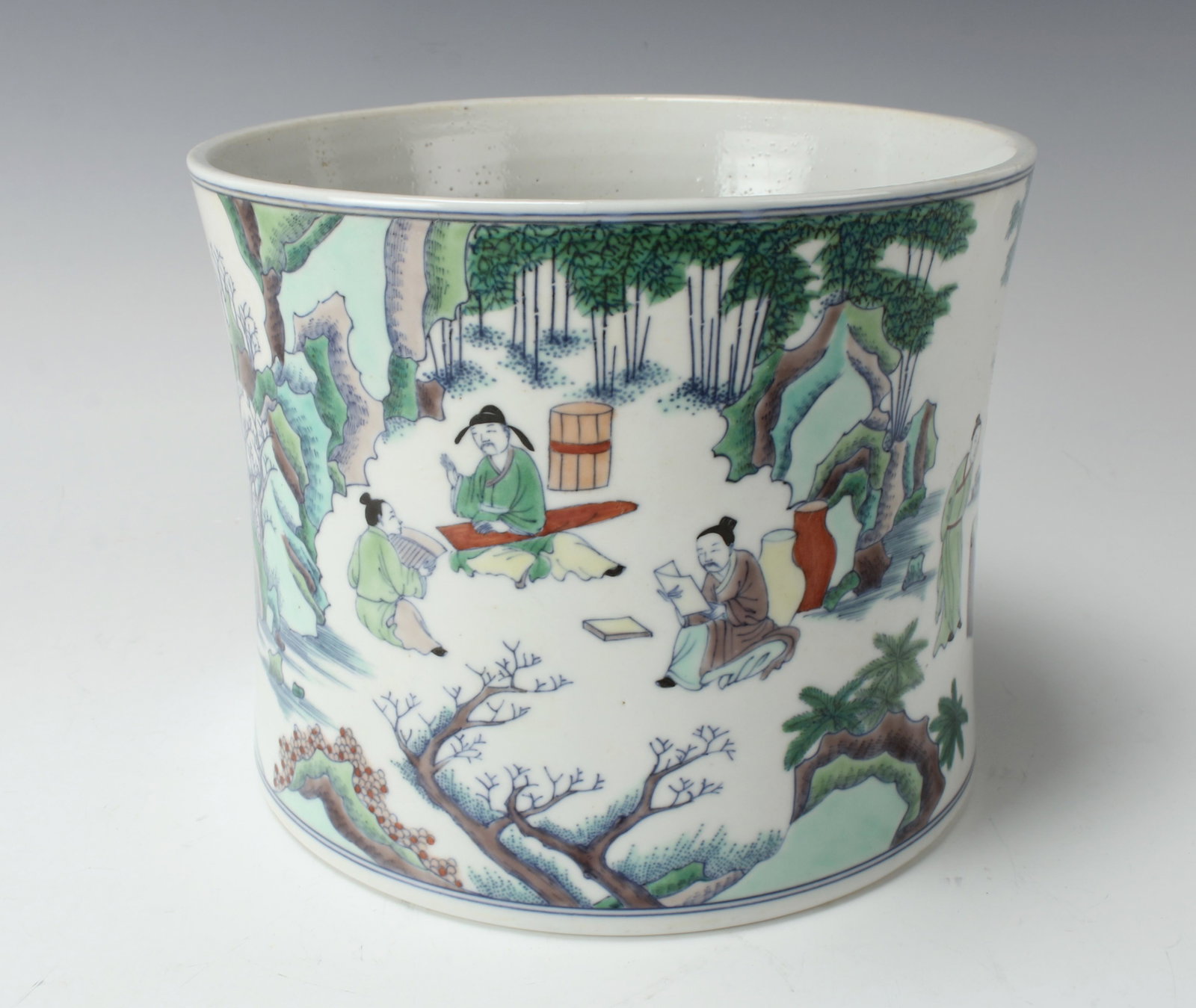 FINE CHINESE PORCELAIN FAMILLE VERTE BRUSH POT: Scholar's in the garden enjoying leisurely activities. 7 1/2" X 6" $600 - $900 Please contact us for high resolution images of this lot. Shipping: We are