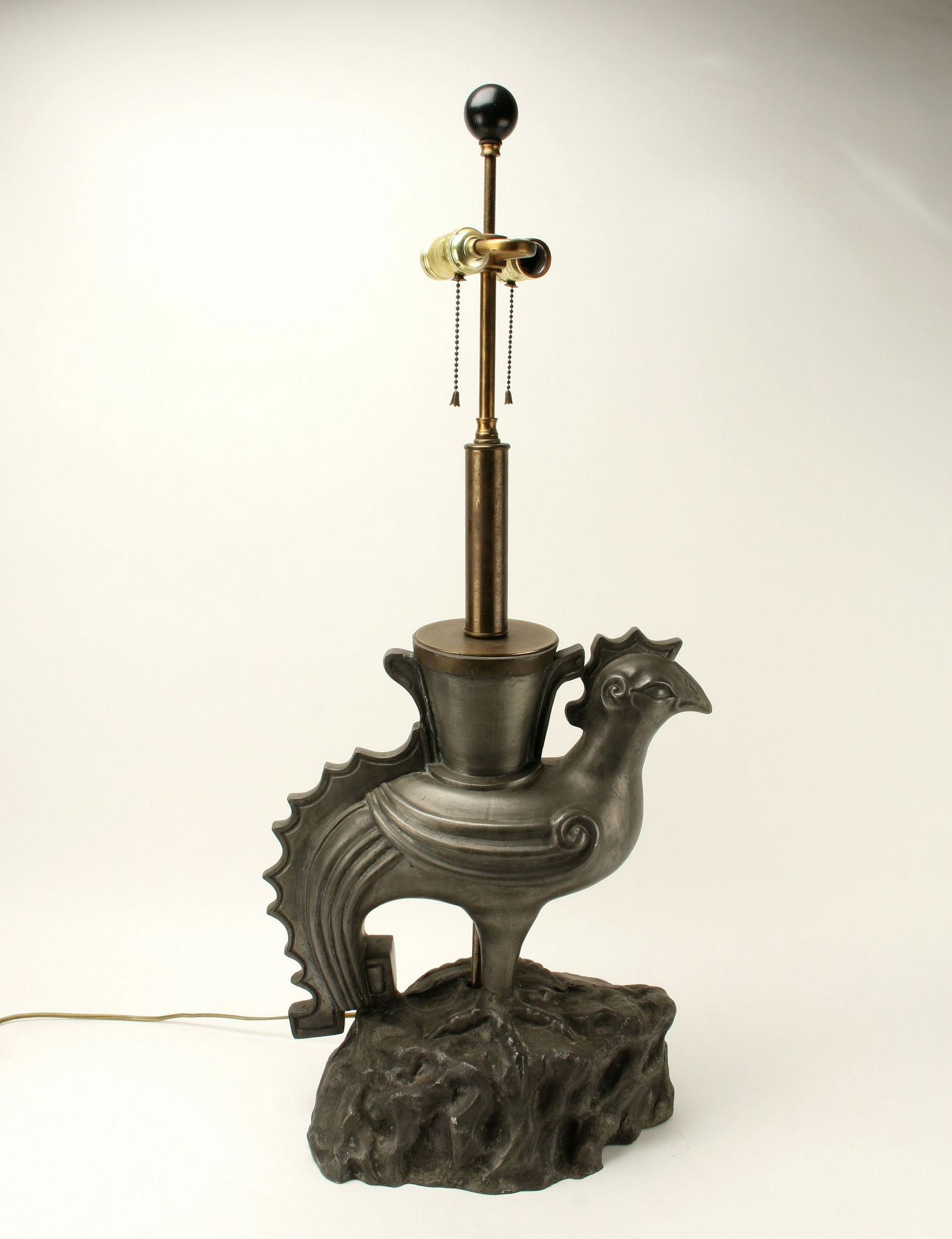 LARGE CHINESE PHOENIX ROOSTER LAMP: Darkly silvered metal on a boulder form. Wired for two bulbs. 16" X 35 1/2" $40 - $80 Please contact us for high resolution images of this lot. Shipping: