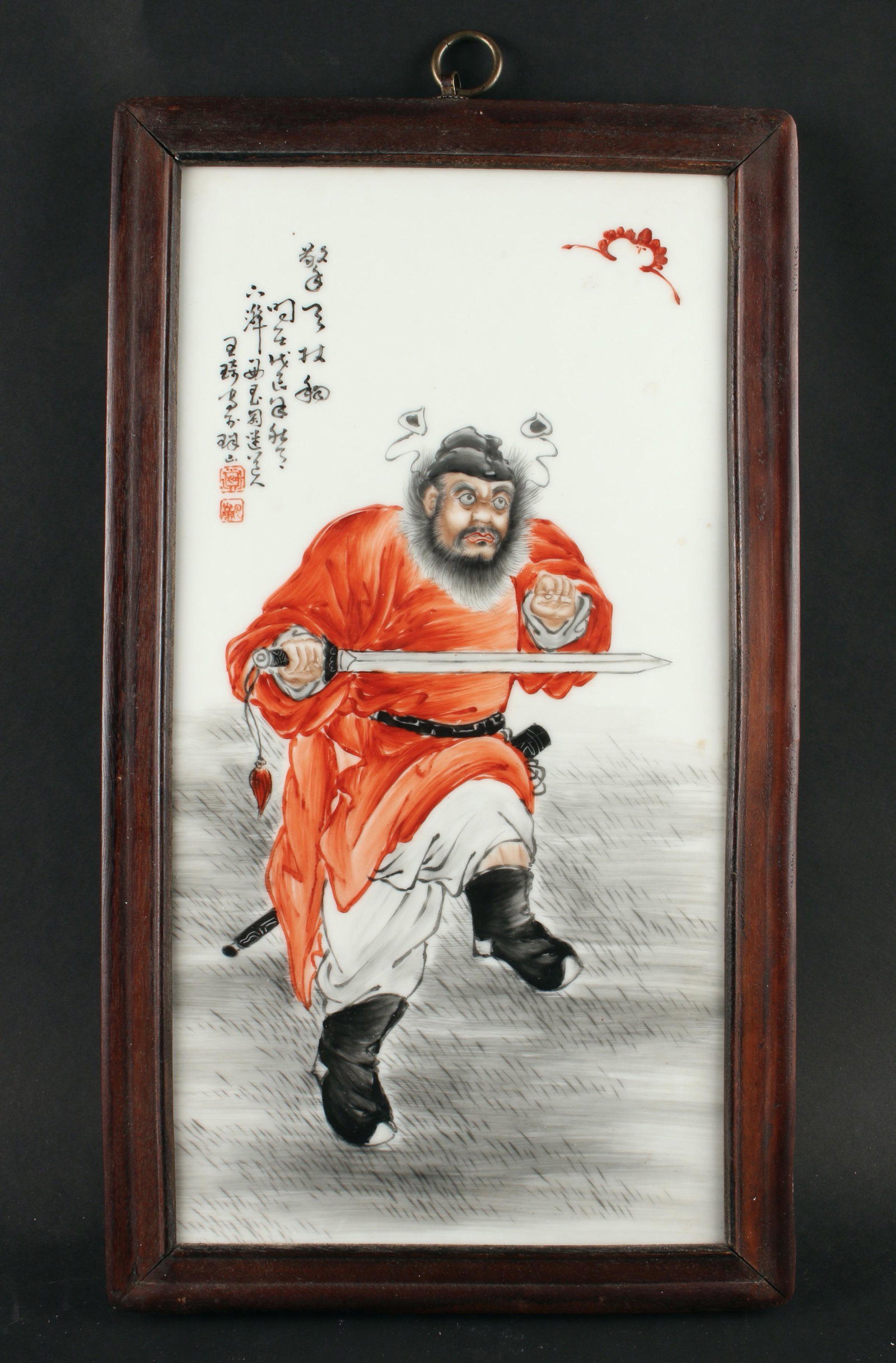 WANG QI STYLE PORCELAIN PLAQUE: A warrior in orange robes is holding a sword across his body. Calligraphy and artist mark on upper left. 9 1/2" X 16 1/2" $200 - $400 Please contact us for high resolution images of t