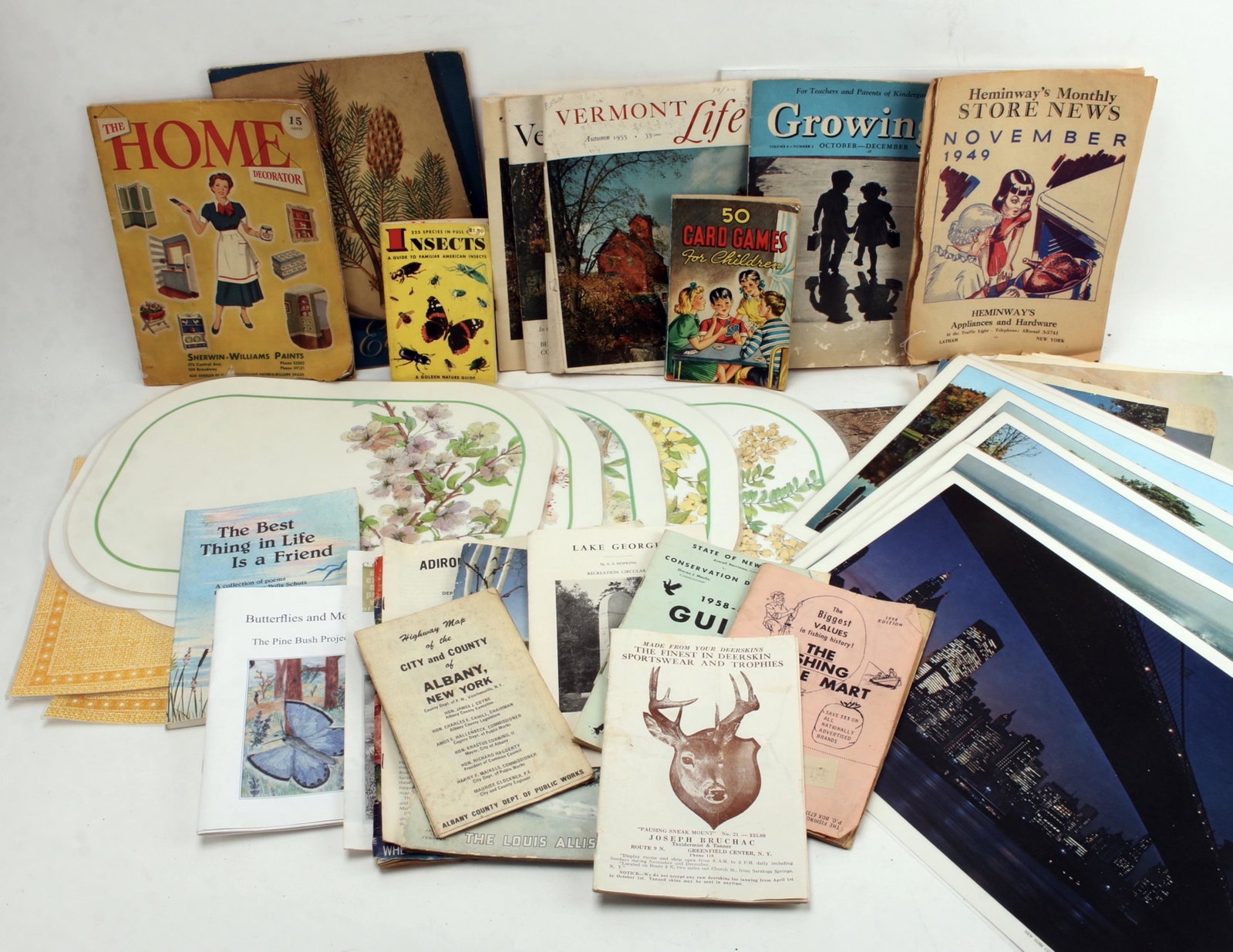 LARGE LOT OF VINTAGE EPHEMERA NEW YORK STATE: New York and Vermont magazines. Various placemats, catalogs, card games for children, Sherwin Williams decorating magazine, and many covers from vintage calendars. $40 - $80 Please contact us for high