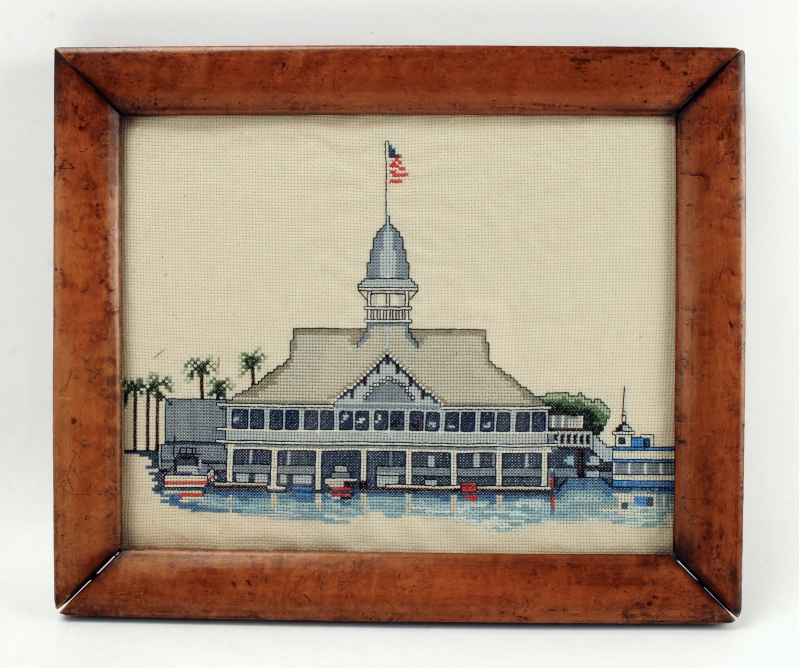 BALBOA PAVILION NEWPORT BEACH CROSS STITCH: The real Balboa Pavilion is located in Newport Beach, CA. This image is created in cross stitch and framed in a birds eye maple wood. 15" X 12 1/2" $20 - $40 Please contact us for hig