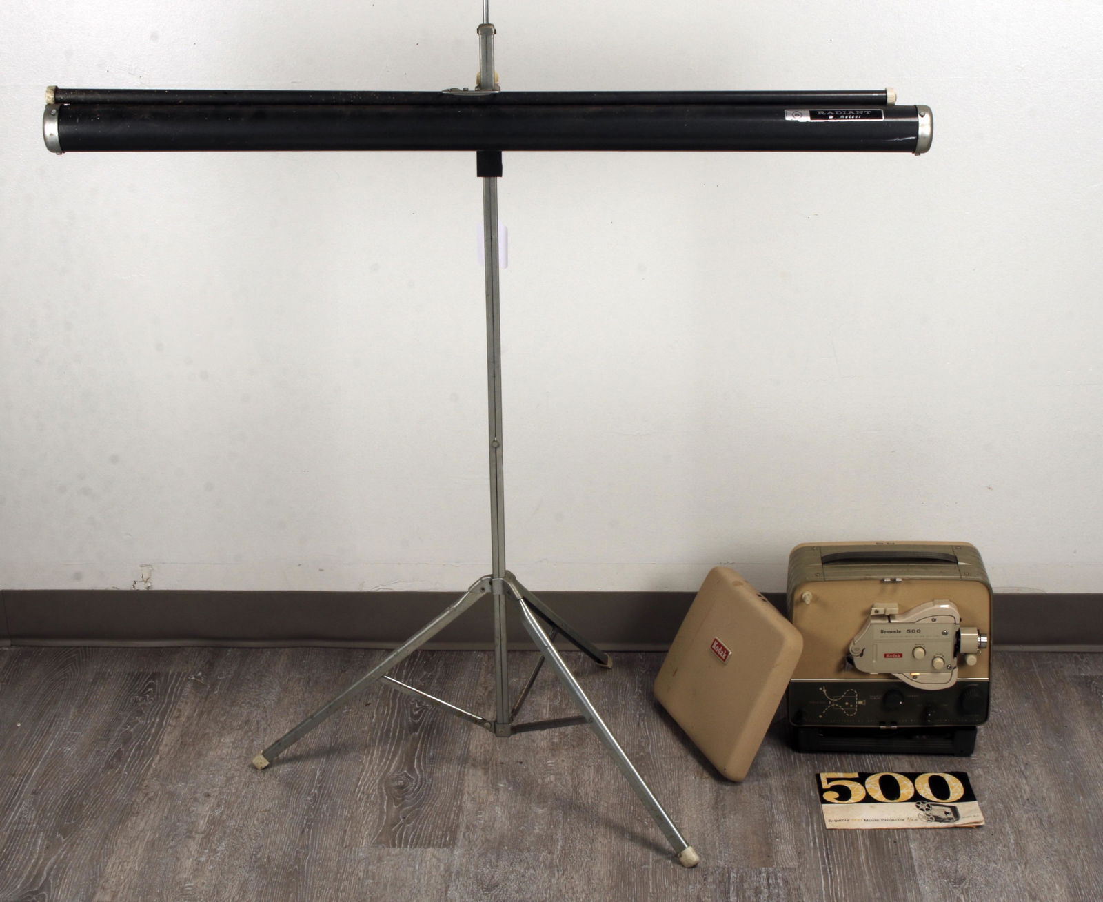 VINTAGE KODAK BROWNIE PROJECTOR & RADIANT SCREEN: Radiant Meteor projector screen. Kodak Brownie 500 in original box. With manuals. 43" X 24" $100 - $200 Please contact us for high resolution images of this lot. Shipping:<