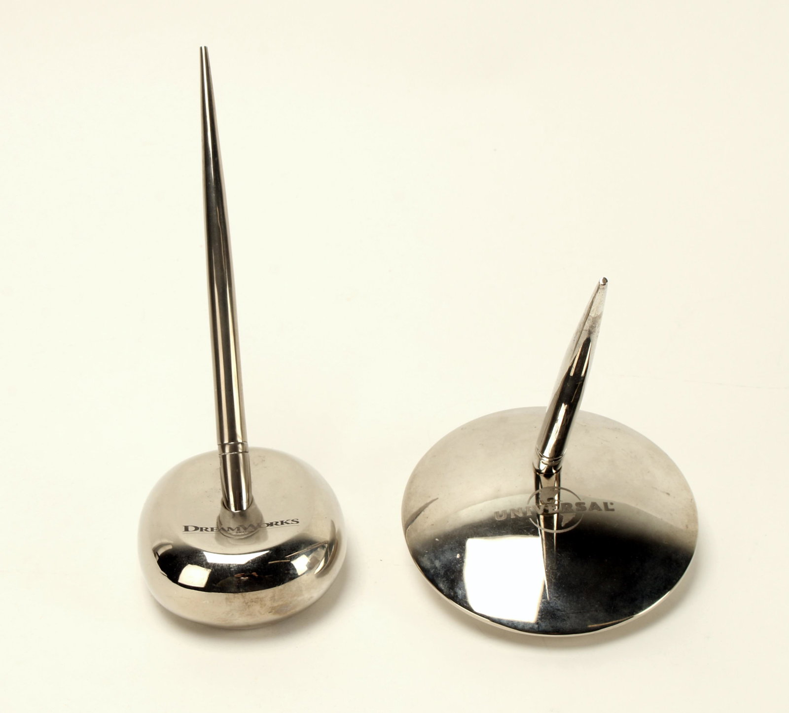 DREAMWORKS AND UNIVERSAL DESK PEN SETS: Two desk pen sets. One by DreamWorks. One by Universal. Both are ballpoint pens. Make yourself feel like a DreamWorks executive. $20 - $40 Please contact us for high resolution images of this lot. Shi