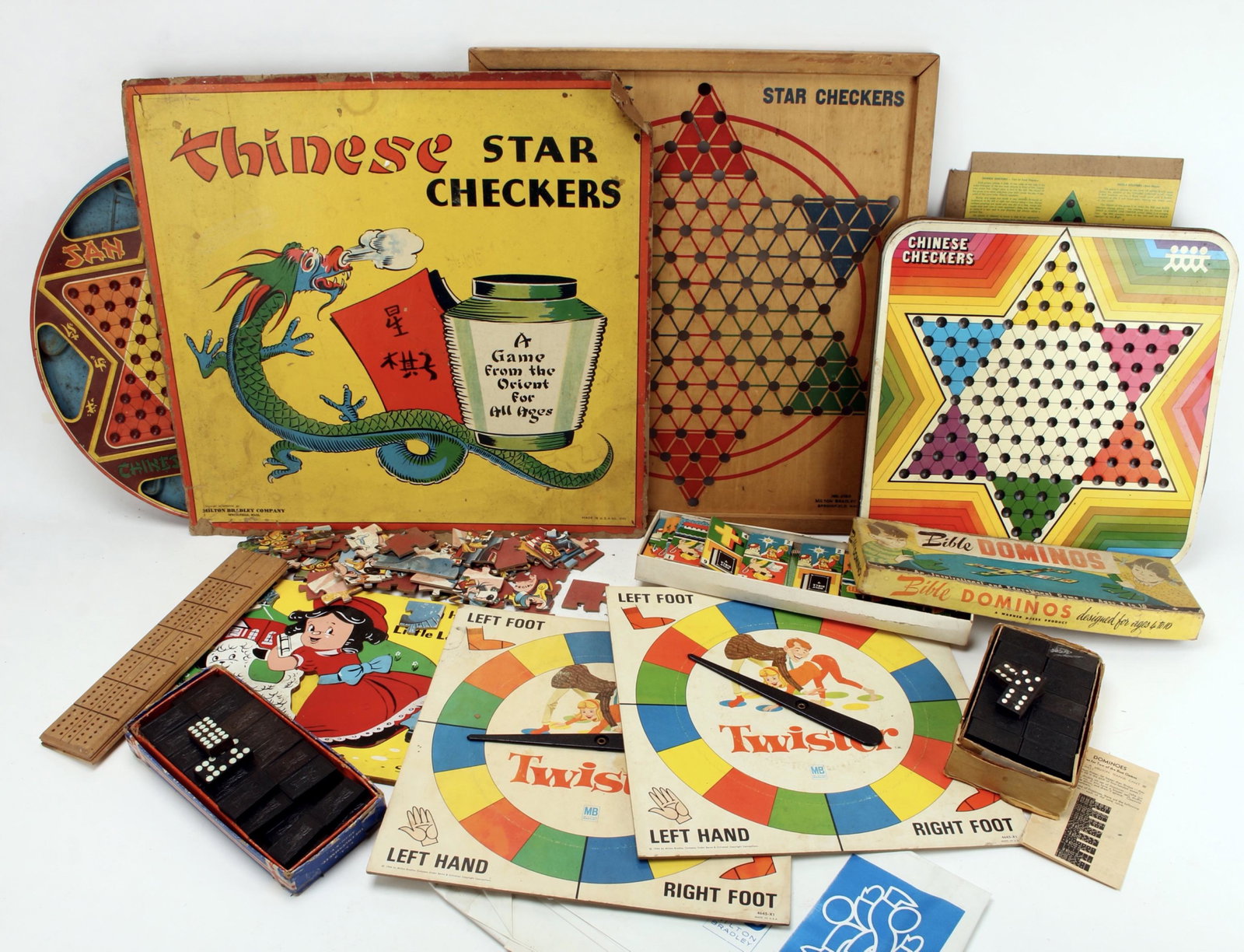 ASSEMBLED LOT OF VINTAGE TOYS & GAMES: Including 3 Chinese Checkers (one flips over to checkers dated 1953). One Pressman Toy Company, one Milton Bradley star checkers 1938 has original cardboard lid with bright colorful dragon. 2 Twister 
