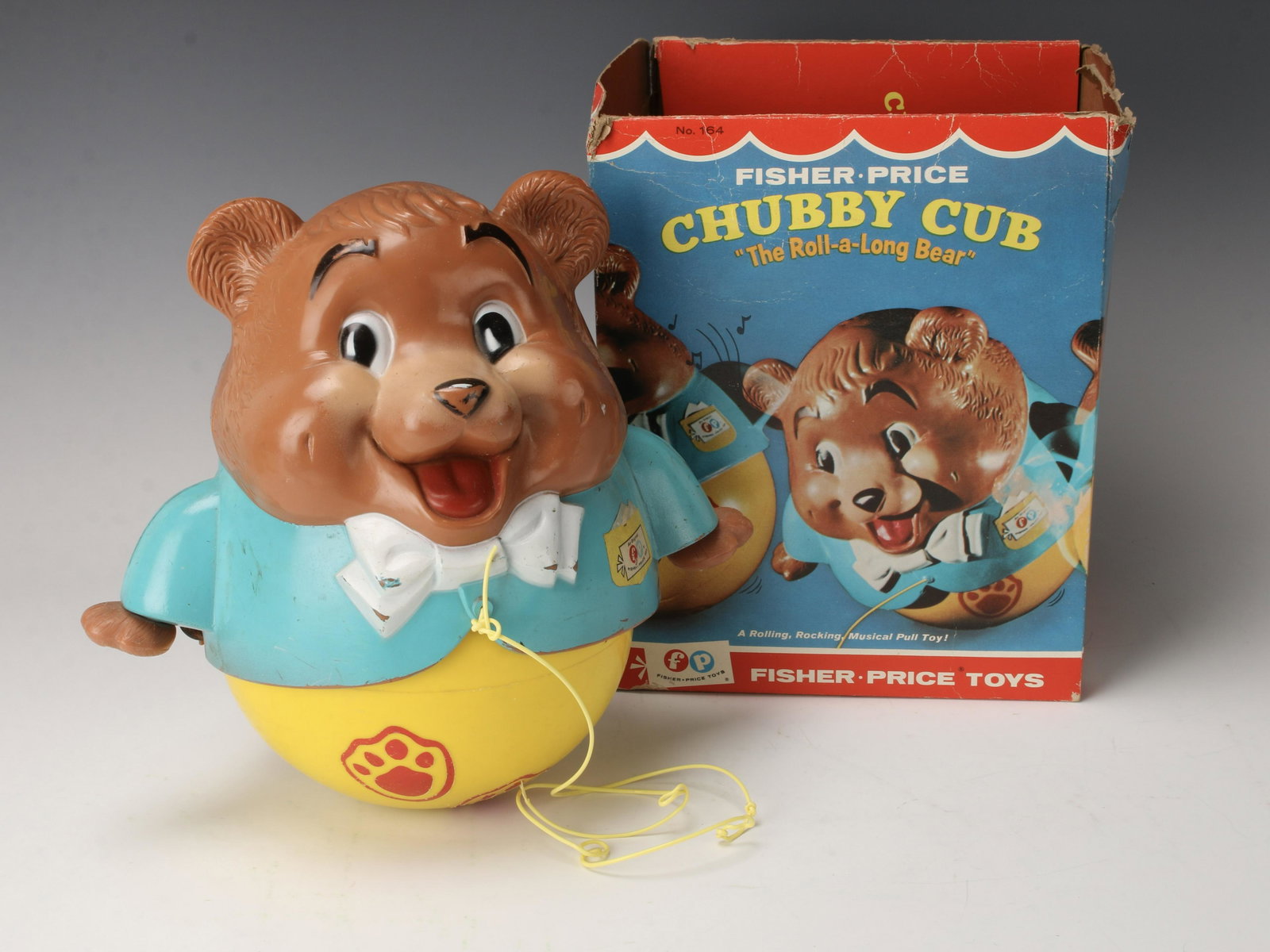 1969 FISHER PRICE CHUBBY CUBBY IN BOX: The Roll-a-long bear! No. 164, box dated 1969. With pull string so he comes with you every where you go! 9 1/2" X 7" X 8" $100 - $200 Please contact us for high resolution images