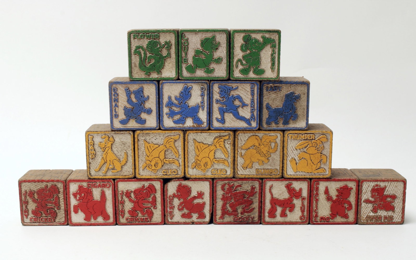 20 WOODEN CARVED DISNEY ALPHABET BLOCKS: Each block represent a Disney character, letters, number, and other images. Block 1 1/4" X 1 1/4" X 1 1/4" $20 - $40 Please contact us for high resolution images of this lot.