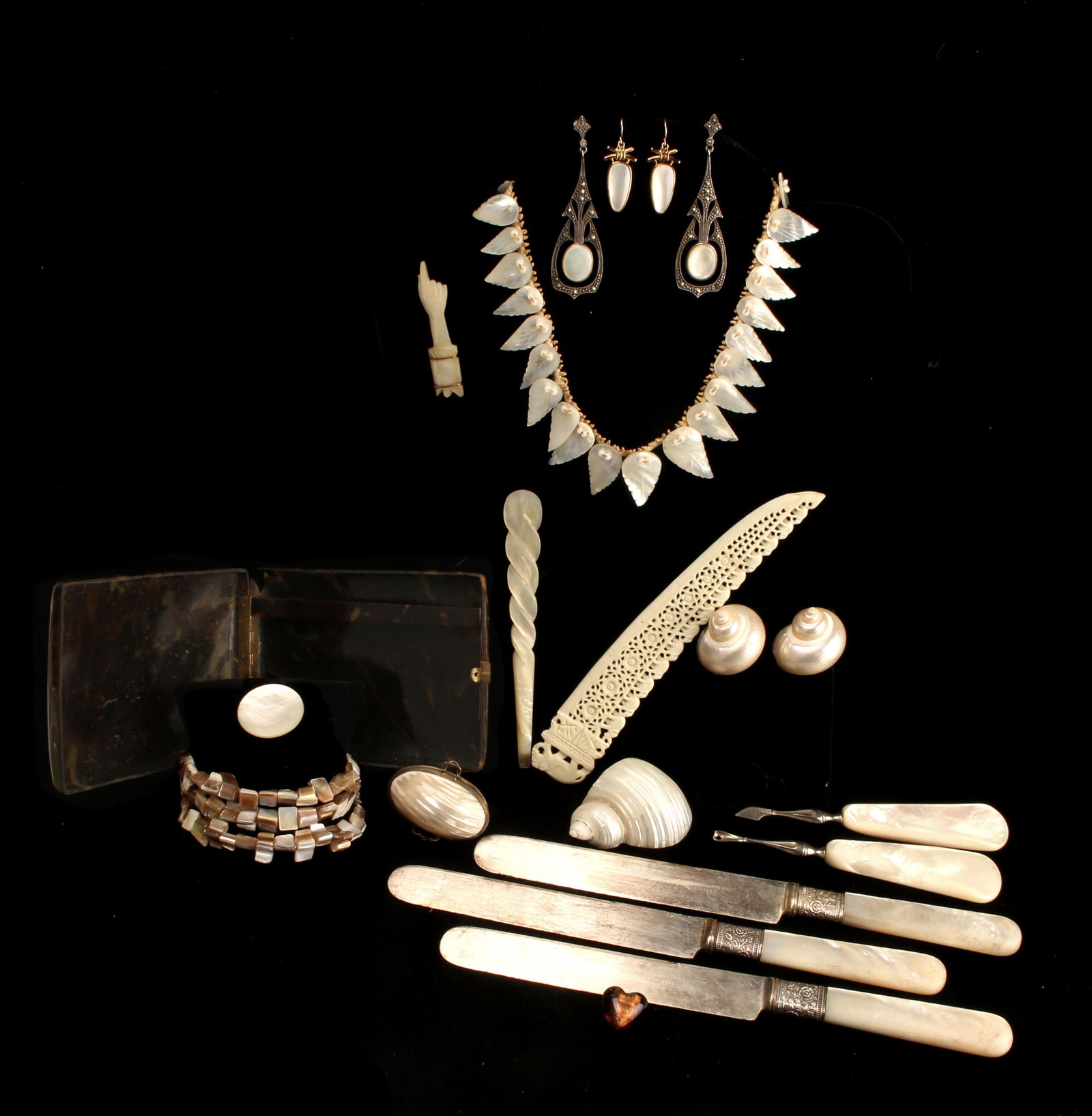 VINTAGE MOTHER OF PEARL TORTOISE SHELL JEWELRY: Mostly jewelry with various decorative items. Three pair earrings (one mother of pearl with marcasite), vanity set tools, bracelet, pins, tortoise shell cigarette box, three pearl handled knives, box 