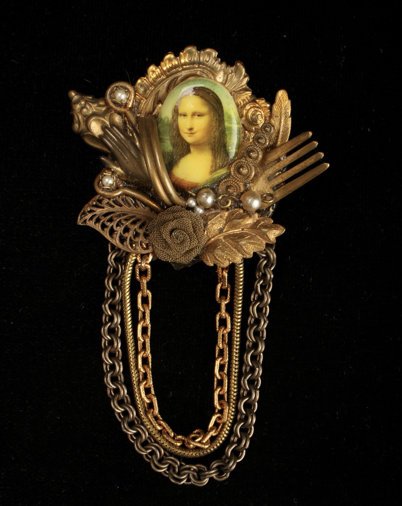 VINTAGE MAXIMAL ART PIN: Designed by John Wind of Maximal Art. Featuring Mona Lisa in the center, and numerous other mixed media elements. Marked on back. 2" $40 - $80 Please contact us for high resolution images