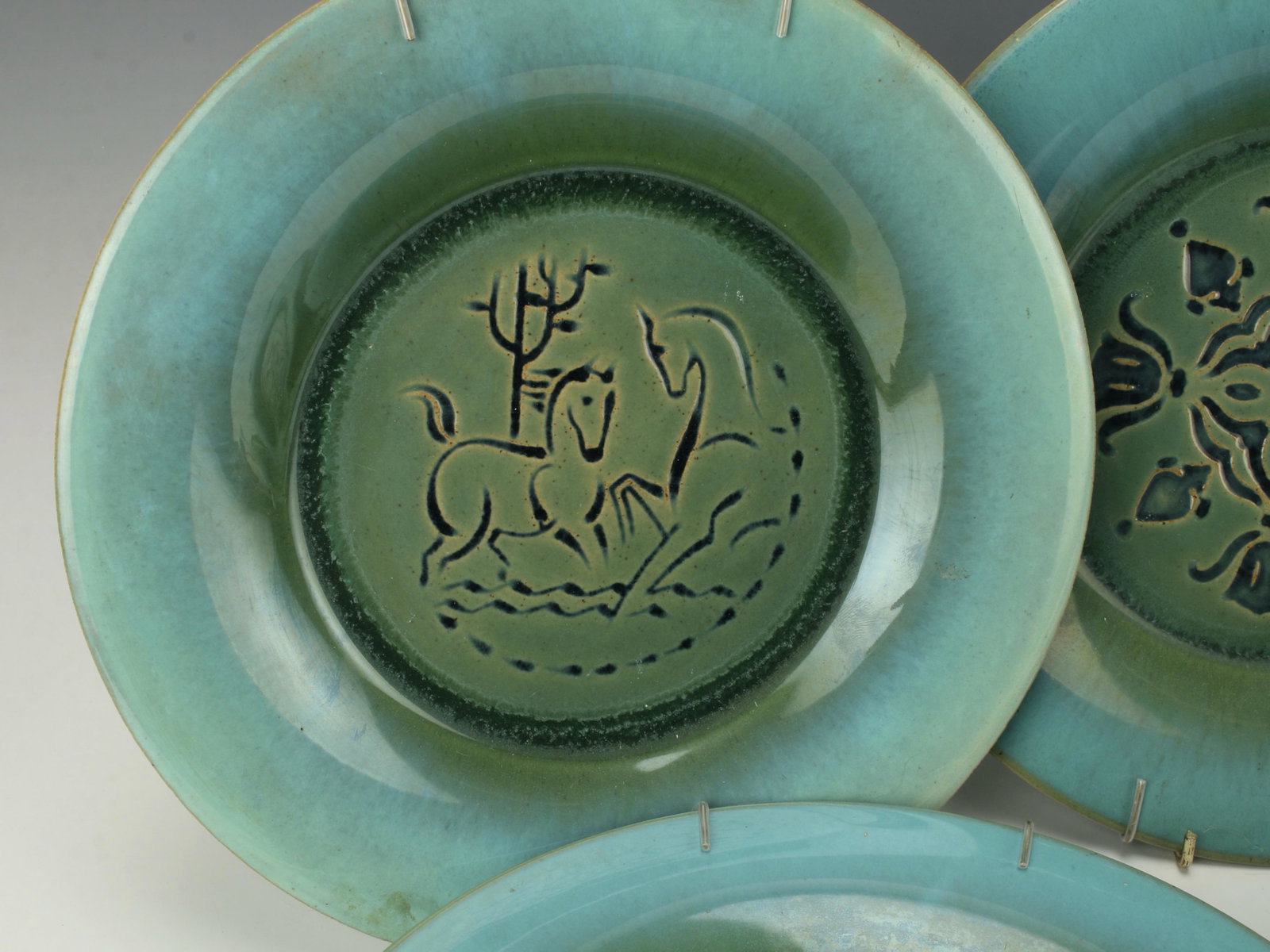 6 US QUARRY TILE CO. ROMANY AQUA PLATES: United States Quarry Tile Romany Aqua Green Plates with horse and floral decorations. 5 are marked United States Quarry Tile Co, Romany Tiles, which means they were made from 1926 to 1954, because the