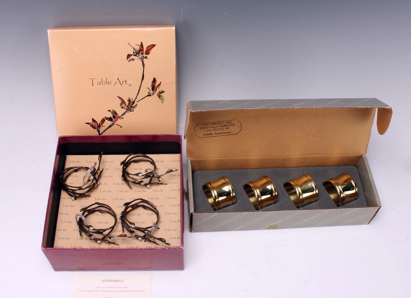 2 SETS NAPKIN RINGS BALDWIN & TABLE ART: Boxed sets: 4 Baldwin Dover Polished Brass No. 7535 and 4 Table Art Pussy Willow Napkin Rings 6 1/4" $20 - $40 Please contact us for high resolution images of this lot. Shipping: