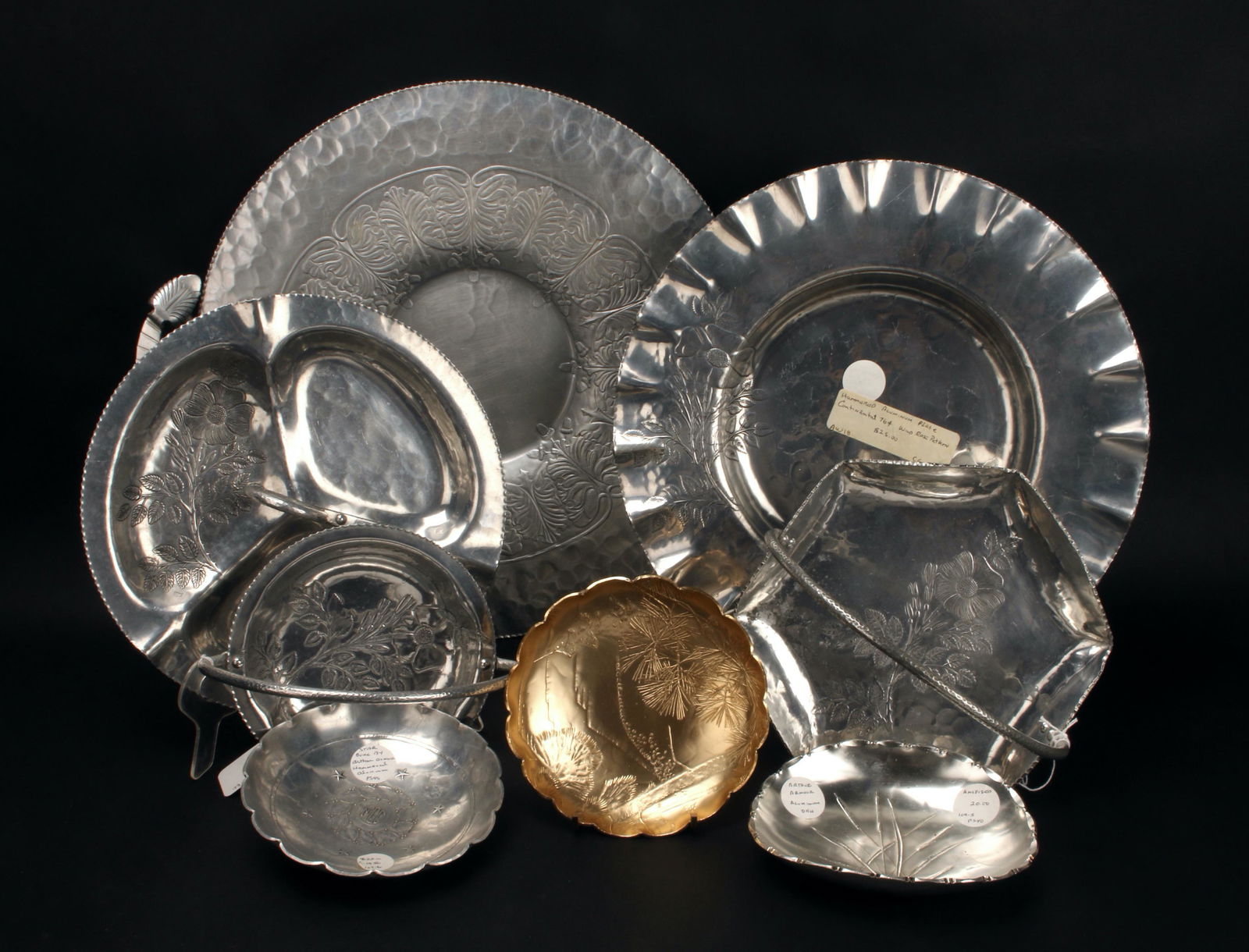 HAMMERED ALUMINUM CONTINENTAL, AUGUST, & ARMOUR: By Continental, Wendell August, and Arthur Armour forges. 2 trays, 2 baskets, 1 divided dish, and 3 small bowls are included in this lot. 16 3/4" x 14" $40 - $80 Please contact us for