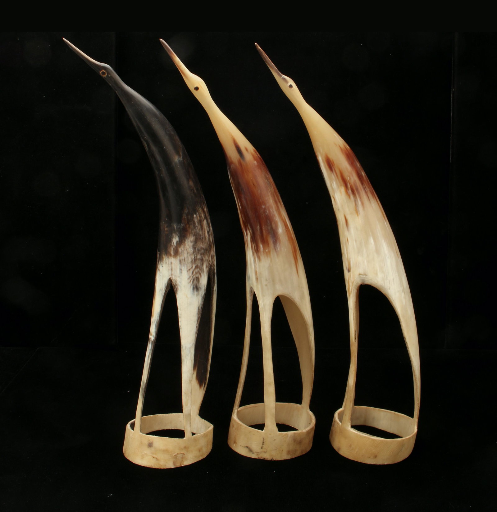 3 MCM STYLIZED CARVED HORN BIRD SCULPTURES: Mid Century sculptures. Deceivingly simple carvings but still evocative of the grace of stilt birds. Would fit in beautifully in any mid century or ethnic decor. 3" X 15" $40 - $80 Pl