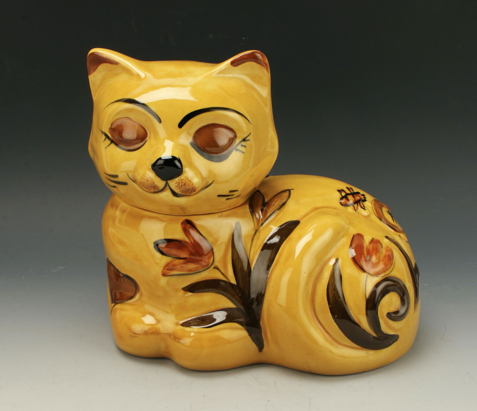 LOS ANGELES POTTERY CAT COOKIE JAR MCM: Sleeping cat cookie jar made by Los Angeles Potteries hand decorated with flowers and bees, California USA '62 10" X 9" $20 - $40 Please contact us for high resolution images of this l