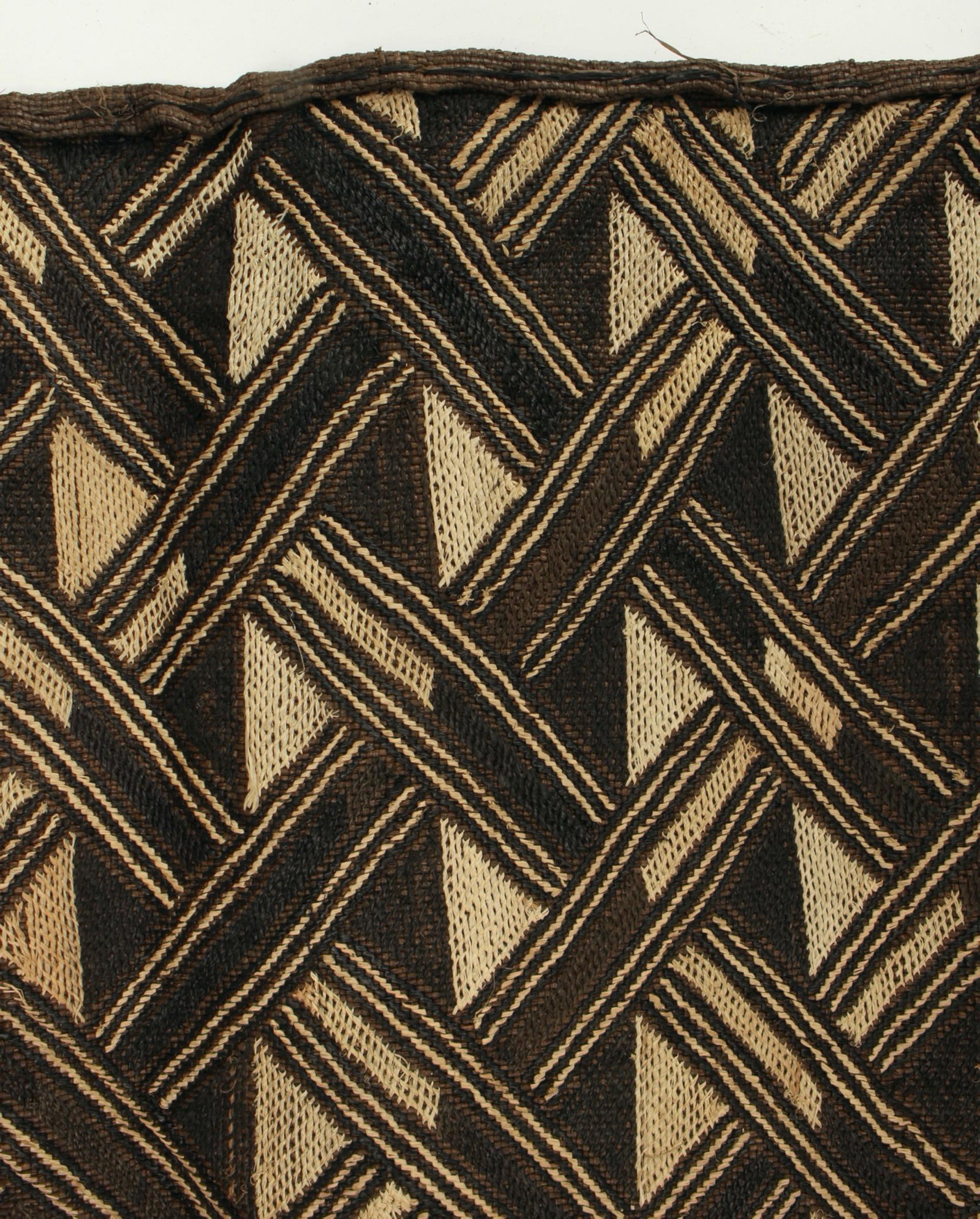KUBA CLOTH WOVEN RAFFIA CONGO: Hand woven cloth using raffia, palm leaves dyed in a variety of earth tones using vegetable dyes. Historically the Kuba people have used the clothes as skirts, sleeping mats, and even currency. 24&quo