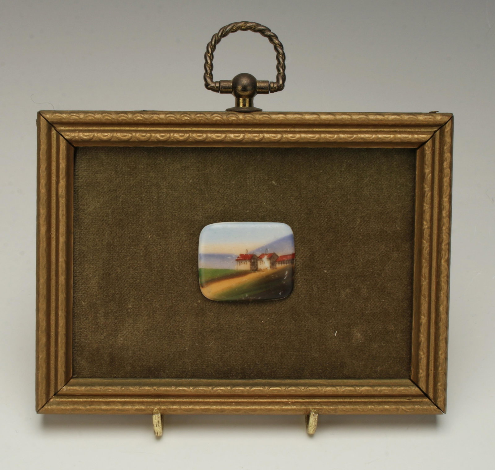 FRAMED FARM SCENE TILE: Tiny ceramic tile of a farm scene, framed on a green velvet backing in gold frame with brass hanger. 5 3/4" X 4 3/4" - Tile 1 x 1 1/4 $20 - $40 Please contact us for high resolution im