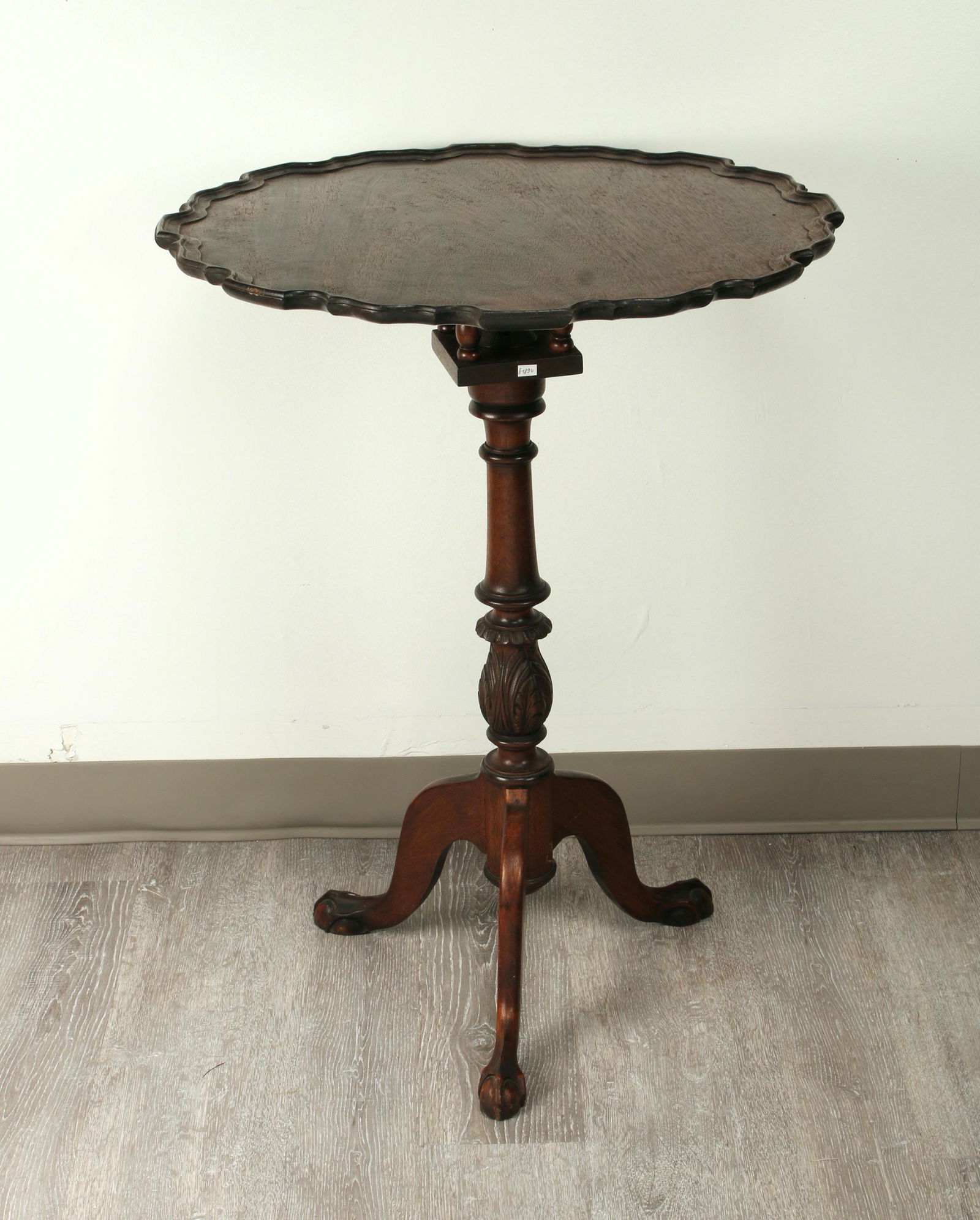 TILT TOP PIE CRUST TRIPOD TABLE: Ball and claw feet. Carved central pedestal. Bird cage support. 23 1/4" X 31 1/4" $100 - $200 Please contact us for high resolution images of this lot. Shipping: