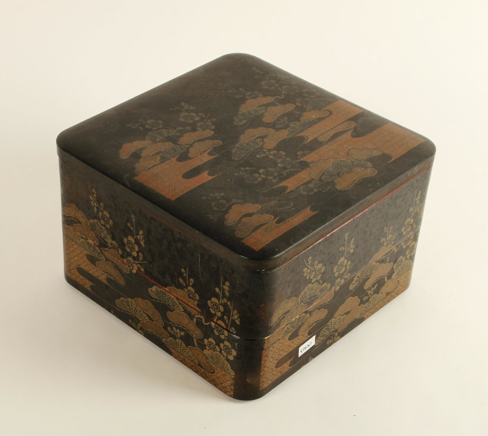 2 TIERED LACQUER BOX: Decorated with flowers and bushes. Interior is orange. 8" x 8" x 5" $20 - $40 Please contact us for high resolution images of this lot. Shipping: We