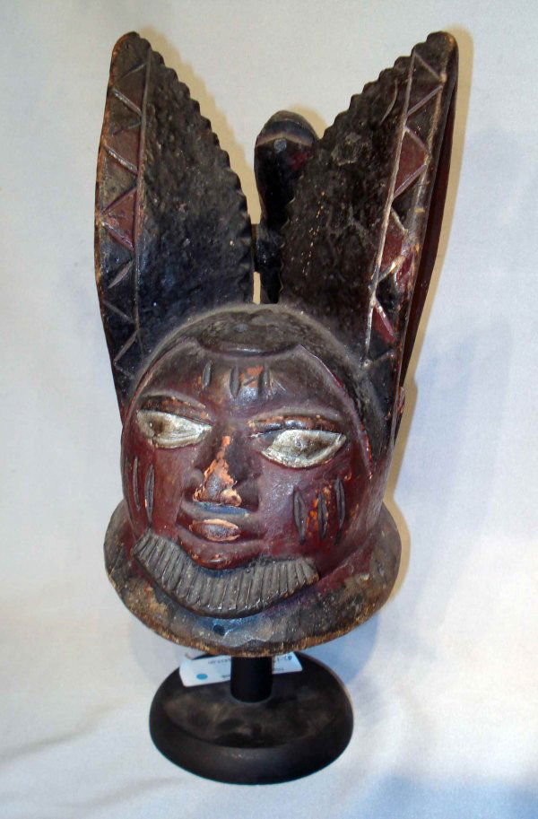 African Dance Mask: A carved soft wood and painted African dance mask of fertility, probably from the Congo area. About 1950.