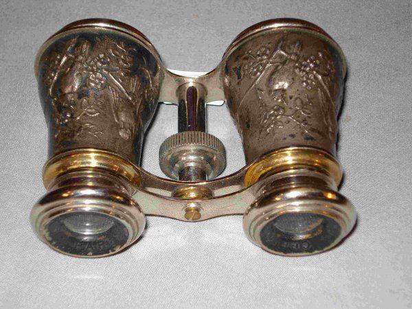 Opera Glasses: A pair of silver and gun metal opera glasses with bas relief of birds.