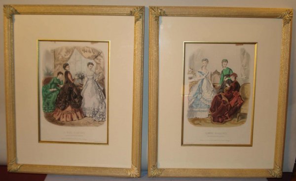 A Pair of Fashion Prints: A pair of engraved and colored fashion prints in impressive gold leaf frames, masked, showing two versions of "La Mode Industrie". Each 18 1/2" X 22 1/2".