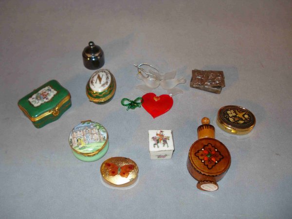 Enamel Pill Boxes: A collection of 10 assorted enamel, porcelain, glass silver, and wood pill boxes and objects of vertu, inluding a hand painted example by Limoges.