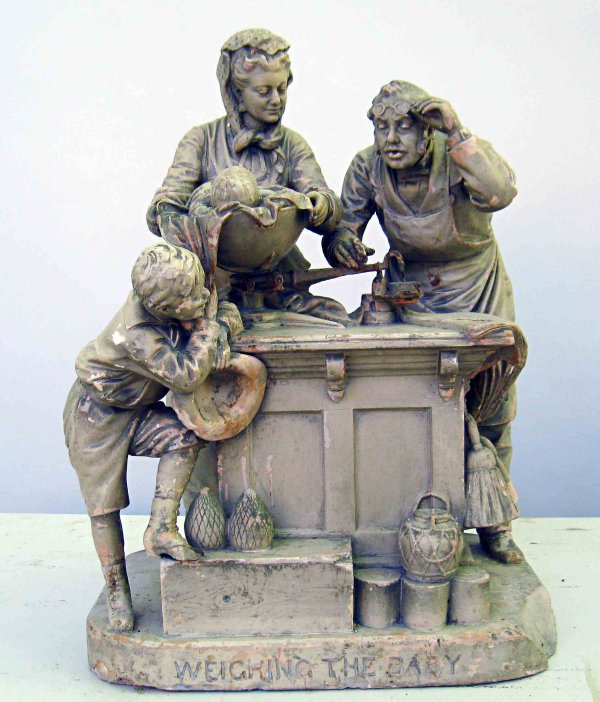John Rogers, New York, "Weighing the Baby": A terra cotta or plaster group by John Rogers entitled "Weighing the Baby" marked "John Rogers, New York" on the base, titled in the front base and in the rear marked "Patented 1885". Damage includes