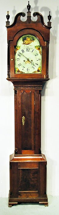 Pennsylvania Tall Case Clock: A solid walnut Chippendale tall case clock, 90" in overall height. The eight day clockworks with a hand painted dial attributed to the firm Patton and Jones (restorations) and the case in the Chippend