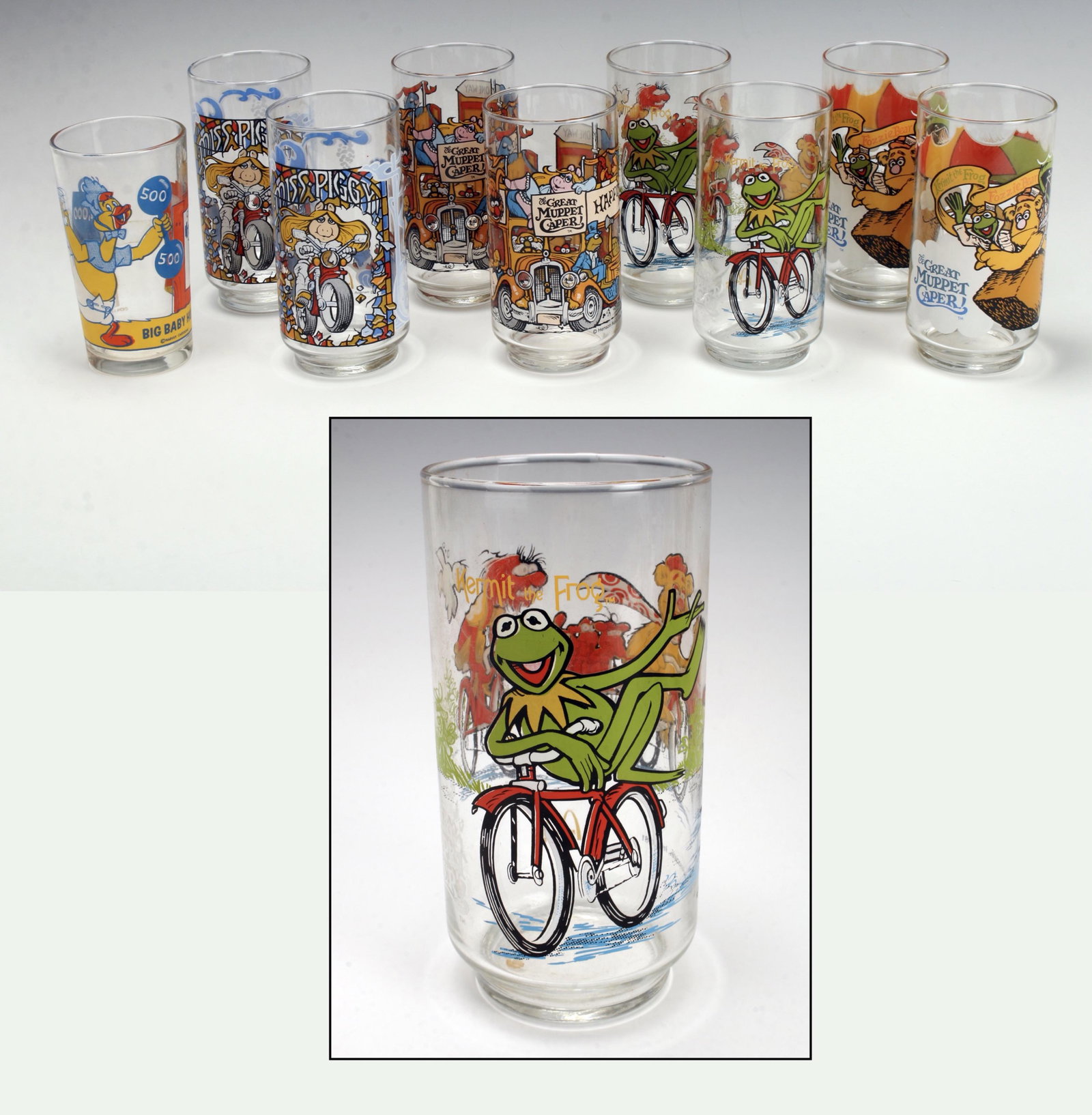 1981 HENSON MUPPET & HARVEY BABY HUEY GLASSES: 2 complete sets of commemorative glasses from The Great Muppet Caper featuring scenes from the movie, released by McDonalds in 1981. Marked Henson Associates In 1981 Big Baby Huey Pepsi Collector Seri