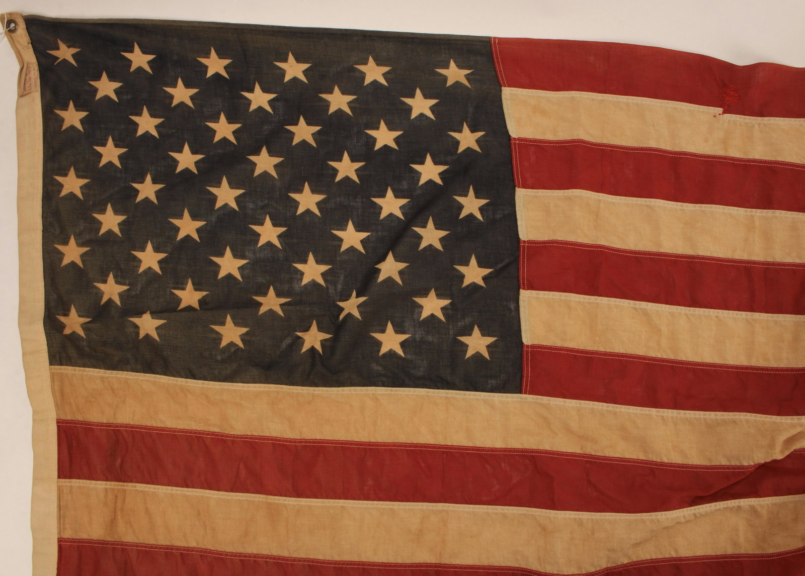 VINTAGE AMERICAN FLAG: Label states Valley Forge Flag Co, Spring City PA. 100% cotton-pioneer. There are some rips and repairs. 3' x 5' $40 - $80 Please contact us for high resolution images of this lot. Shipp