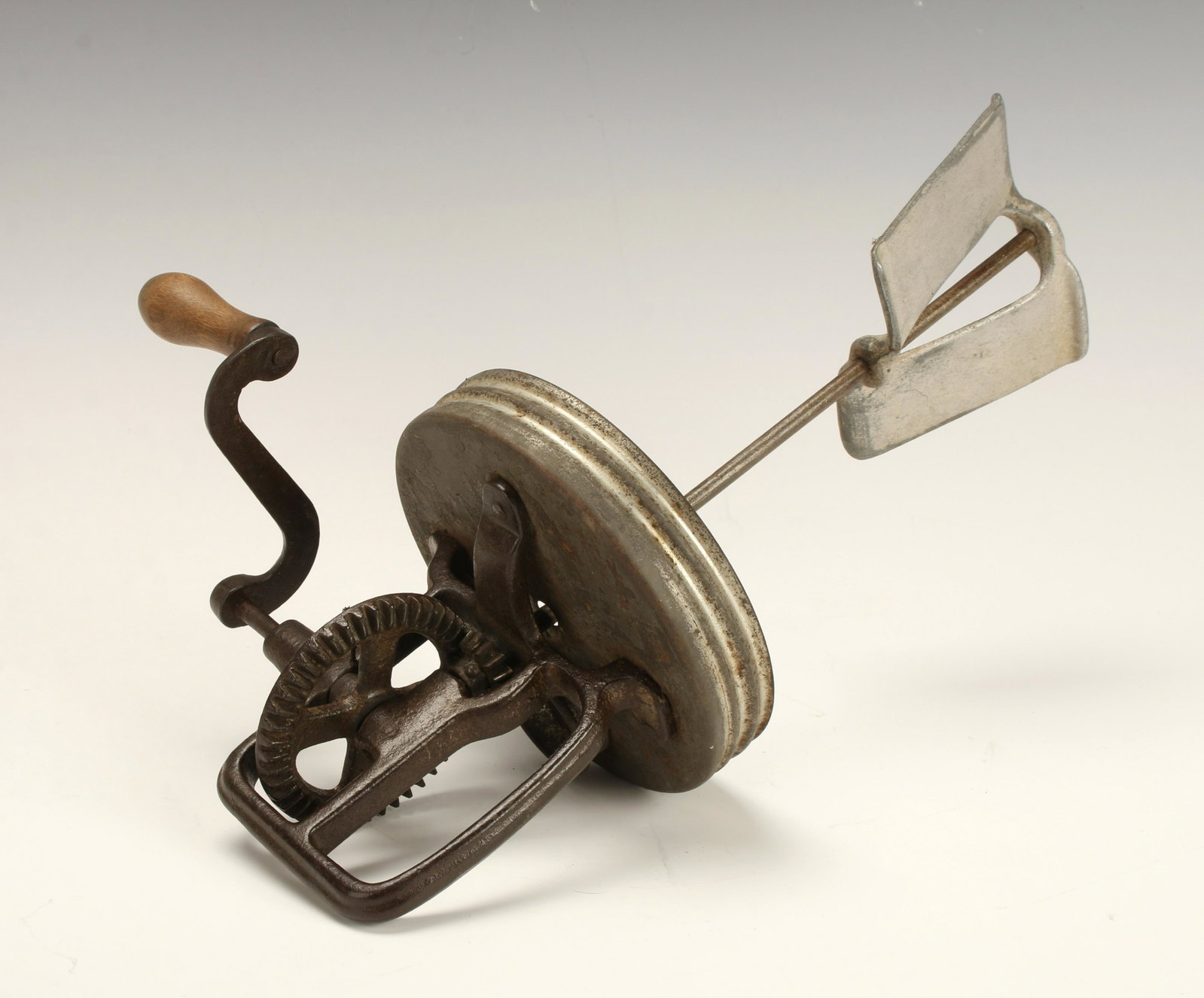 ANTIQUE HAND CRANK BUTTER CHURN: Working hand crank butter churn made to fit over jar approximately 5 1/5" in diameter with vented top. 13" $20 - $40 Please contact us for high resolution images of this lot. Sh