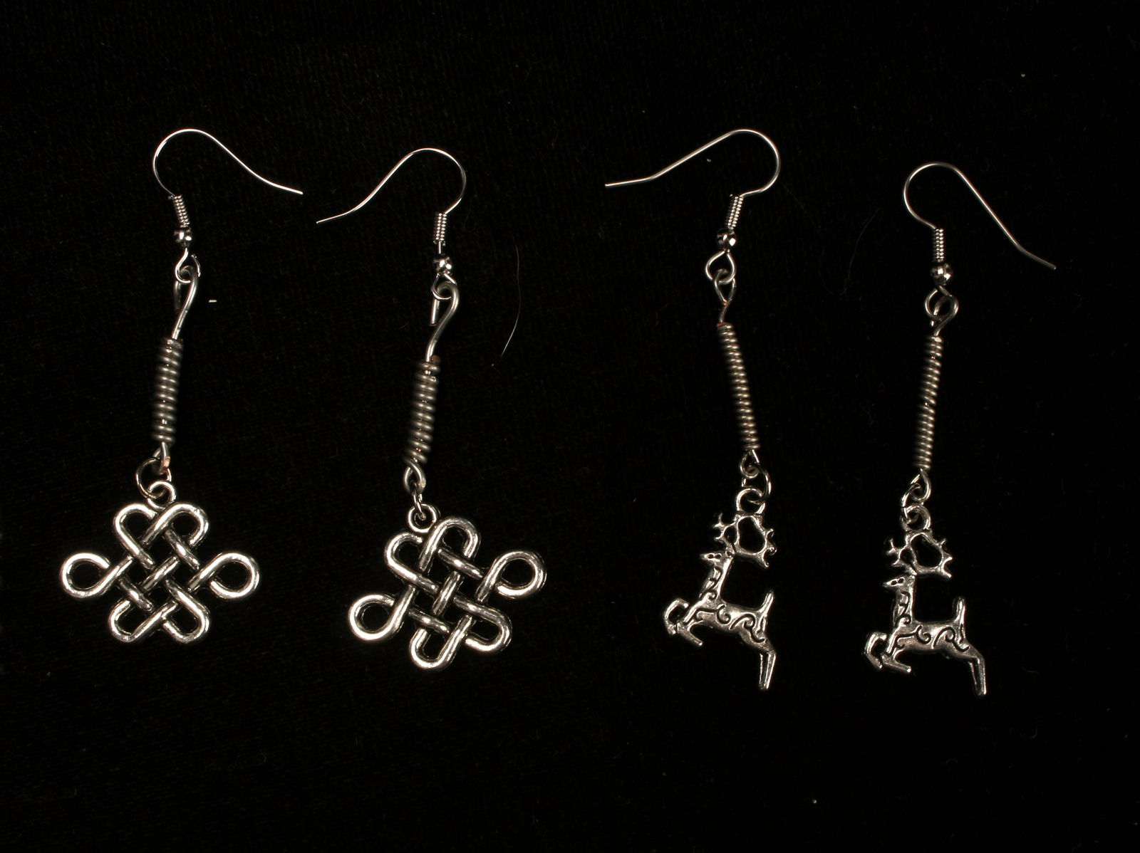 DEER & CELTIC KNOT HANDMADE EARRINGS: Handmade earrings with deer and Celtic knot pendants. $20 - $40 Please contact us for high resolution images of this lot. Shipping: We are able to pack and ship this item to an address in t