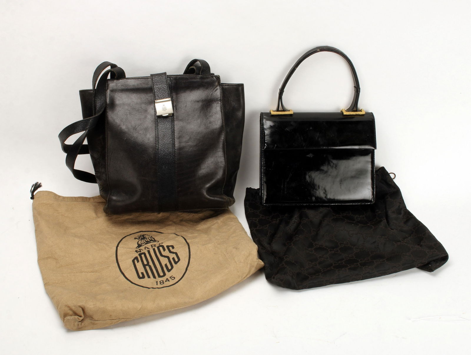 VINTAGE MARK CROSS LEATHER & GUCCI PATENT PURSES: Black leather shoulder bag with silver hardware. Patent leather handbag with gold florentine rectangles where handle meets the bag. Stamped with "G" logo inside in gold. Provenance: