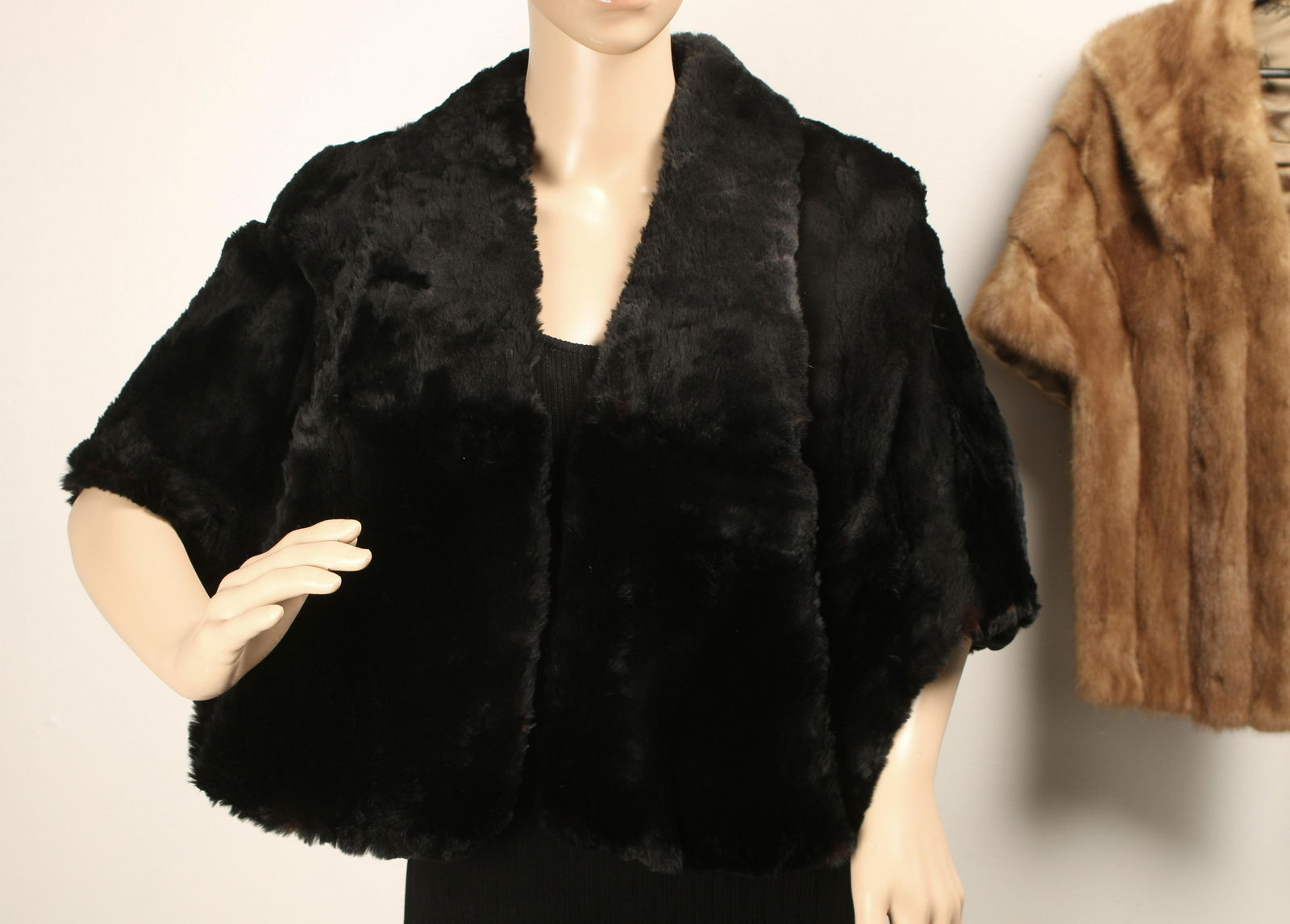 VINTAGE MINK & SHEARED BEAVER FUR STOLES: Vintage amber colored mink and black sheared beaver stoles. Mink collar lifts up to reveal same satin as the lining and has interior pockets. Black fur labeled Regal Furs, Albany NY, and mink labeled