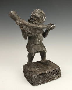 METAL TIKAR HORN BLOWER CAMEROON: Metal Tikar Horn Blower CameroonAluminum figure of a bearded man blowing a horn. Wearing skirt an