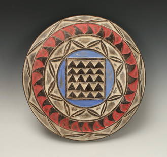 SOUTH AFRICAN ZULU SHIELD: South African Zulu Shield Concentric geometric borders. The center has five rows of pyramids. In white, red, and blue. 15 1/2" $100 - $200 Shipping: We are able to pack and ship this item to an