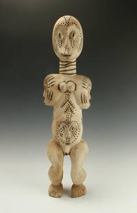 WHITE FETISH LEGA FIGURE CONGO: White Fetish Lega Figure CongoFor fertility and protection. Residue of white paint. Drilled holes accented the forehead, around the eyes, on the neck, on the spirit mask belly, and around the