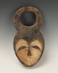 KWELE MARRIAGE MASK GABON: Kwele Marriage Mask GabonHorns joined at the top, heart shaped concave face, and painted black features. 15 1/2" X 7 1/2" $100 - $200 Shipping: We are able to pack and ship this item to an