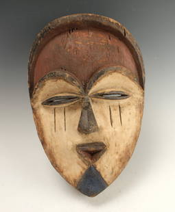 MITSOGO TSOGO MASK GABON: Mitsogo Tsogo Mask GabonRed forehead, white painted heart shape face, protruding triangular mouth, blue triangular chin, and black triangular nose. 14" X 9 1/2" $100 - $200 Shipping: We