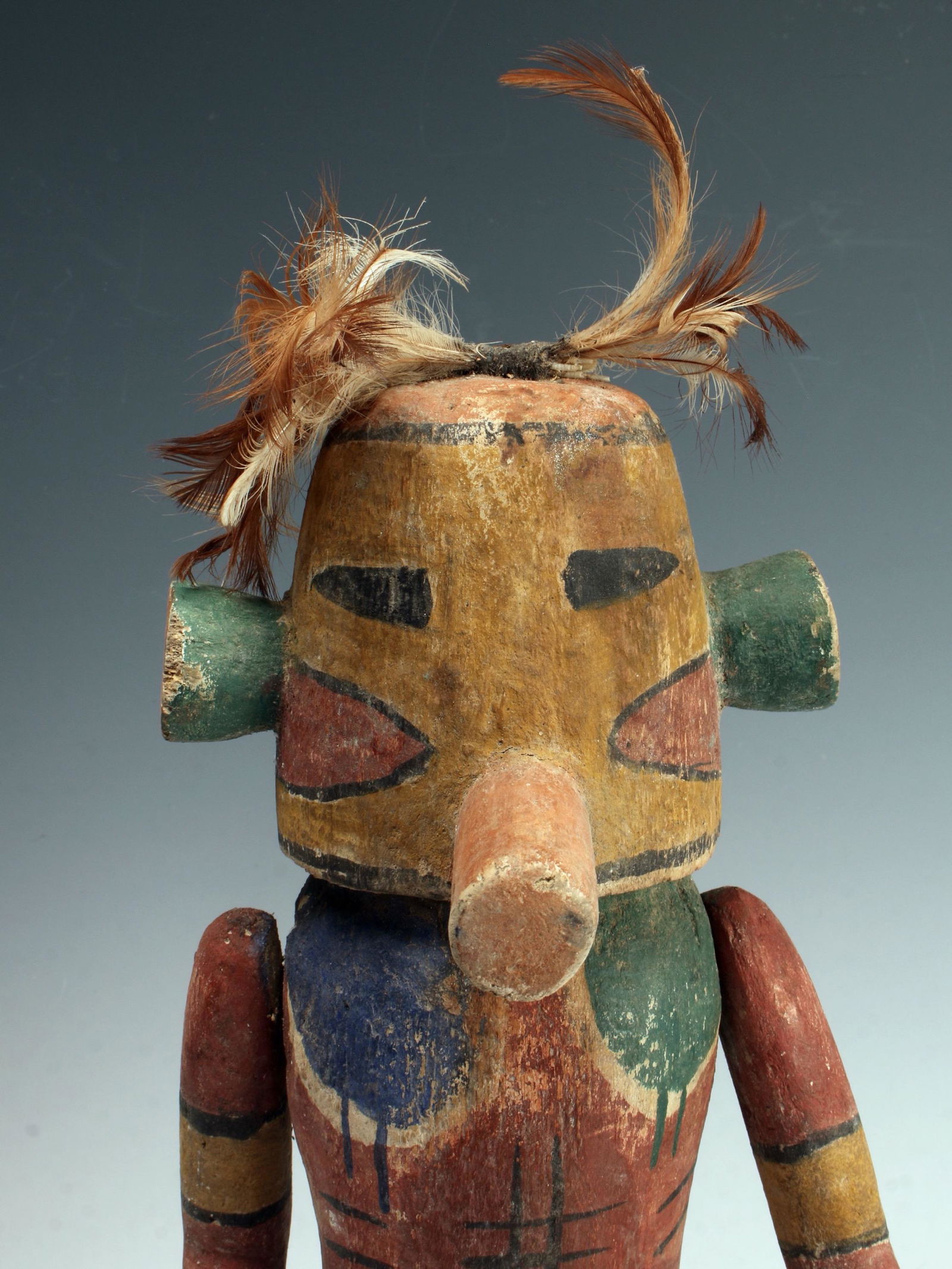 PAINTED WOOD HOPI KATSINA KACHINA FIGURE: Painted Wood Hopi Katsina Kachina FigurePainted wood with jointed arms and feather adornments.