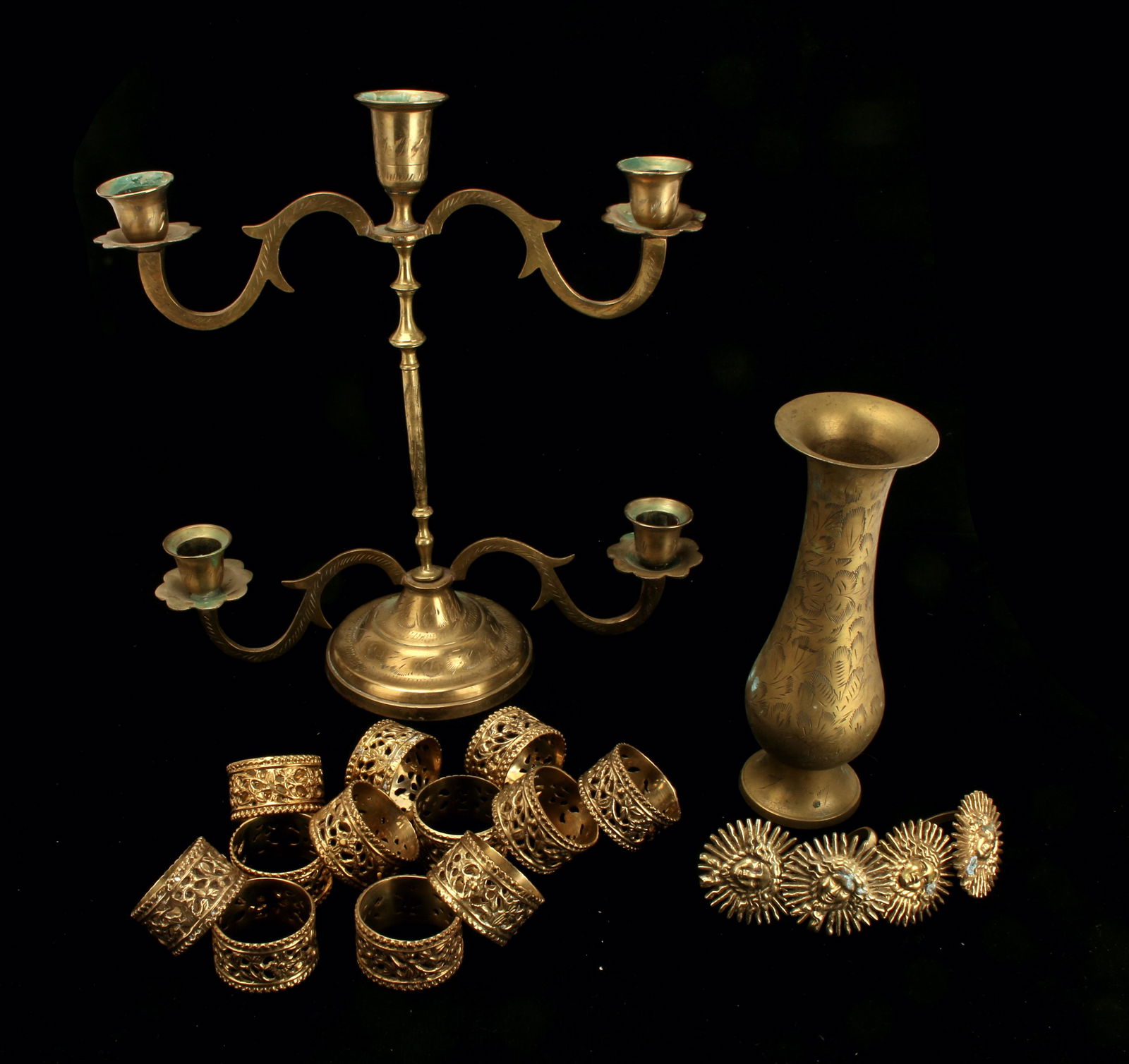 BRASS LOT CANDEHOLDER, VASE, NAPKIN RINGS: Brass Lot Candeholder, Vase, Napkin RingsCandelabra, vase, napkin rings. 12 floral motif and 4 Me